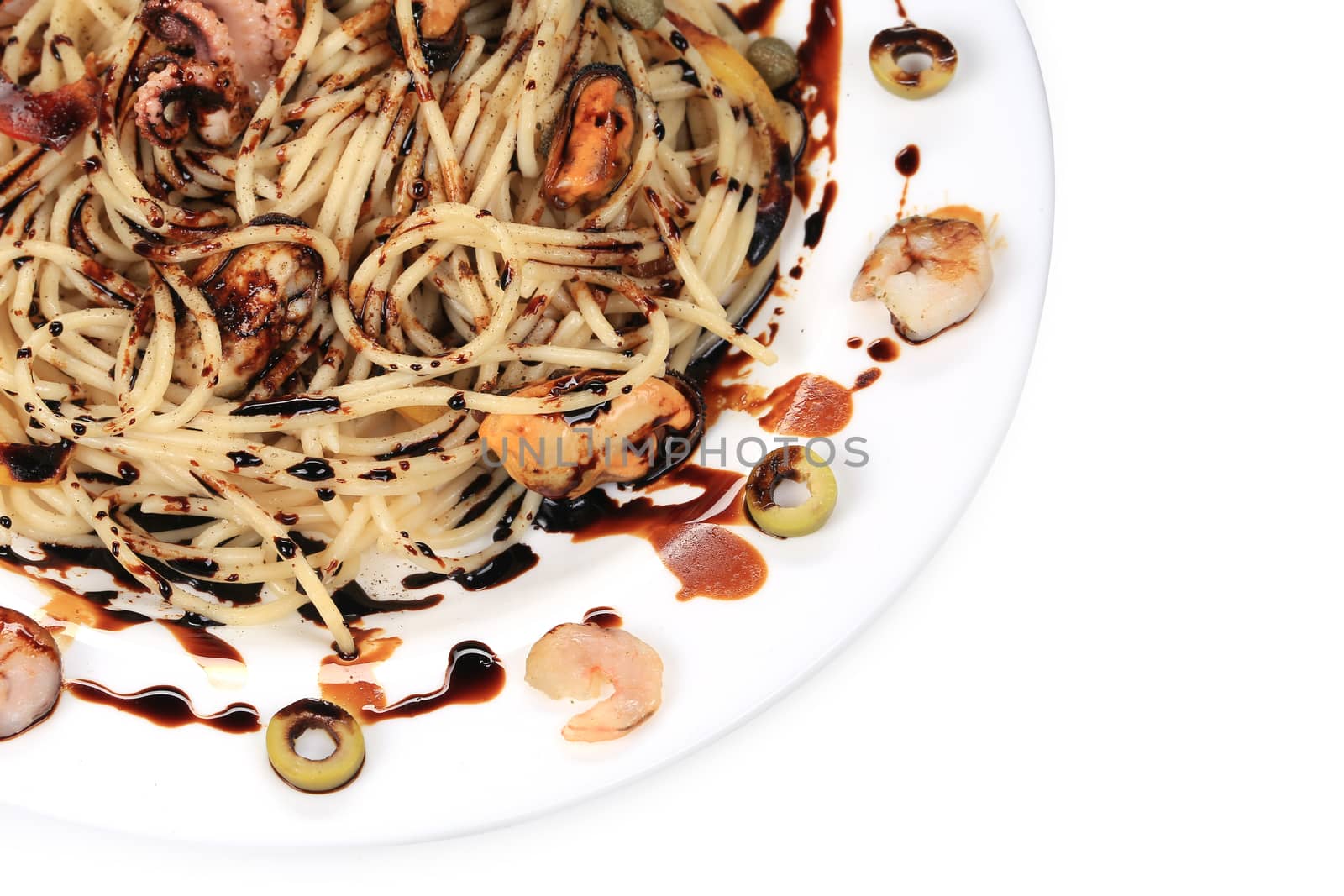 Seafood salad with spaghetti. Close up. Whole background.