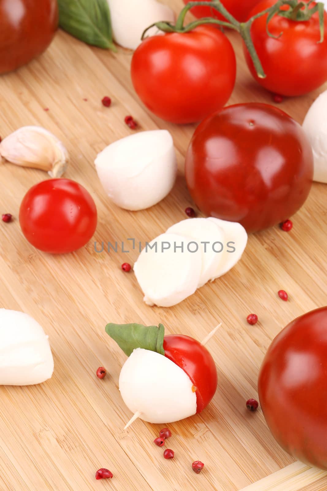 Tomatoes and mozzarella balls. Macro. Whole background.