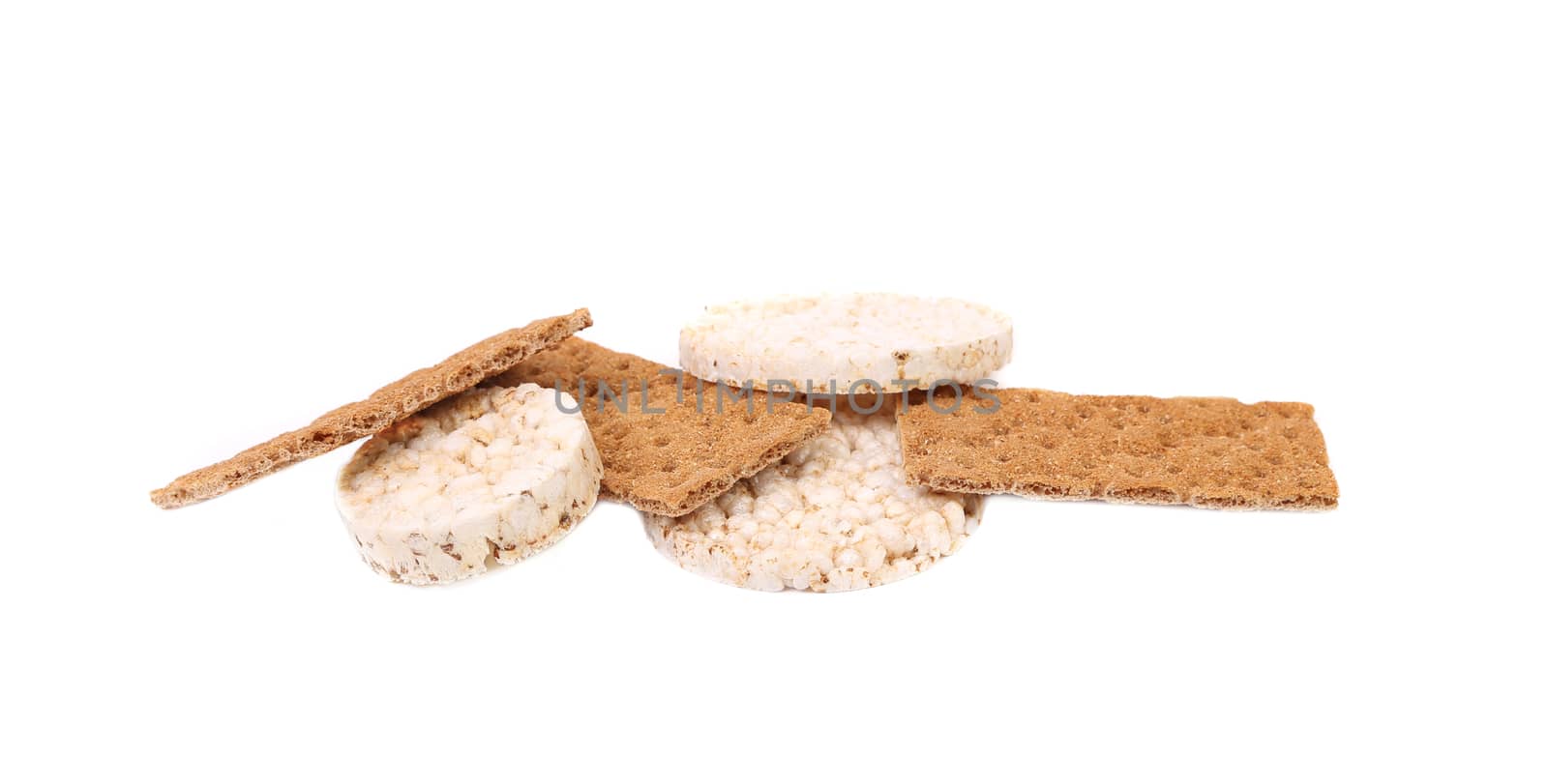 Puffed rice snack and grain crisp bread. Isolated on a white background.