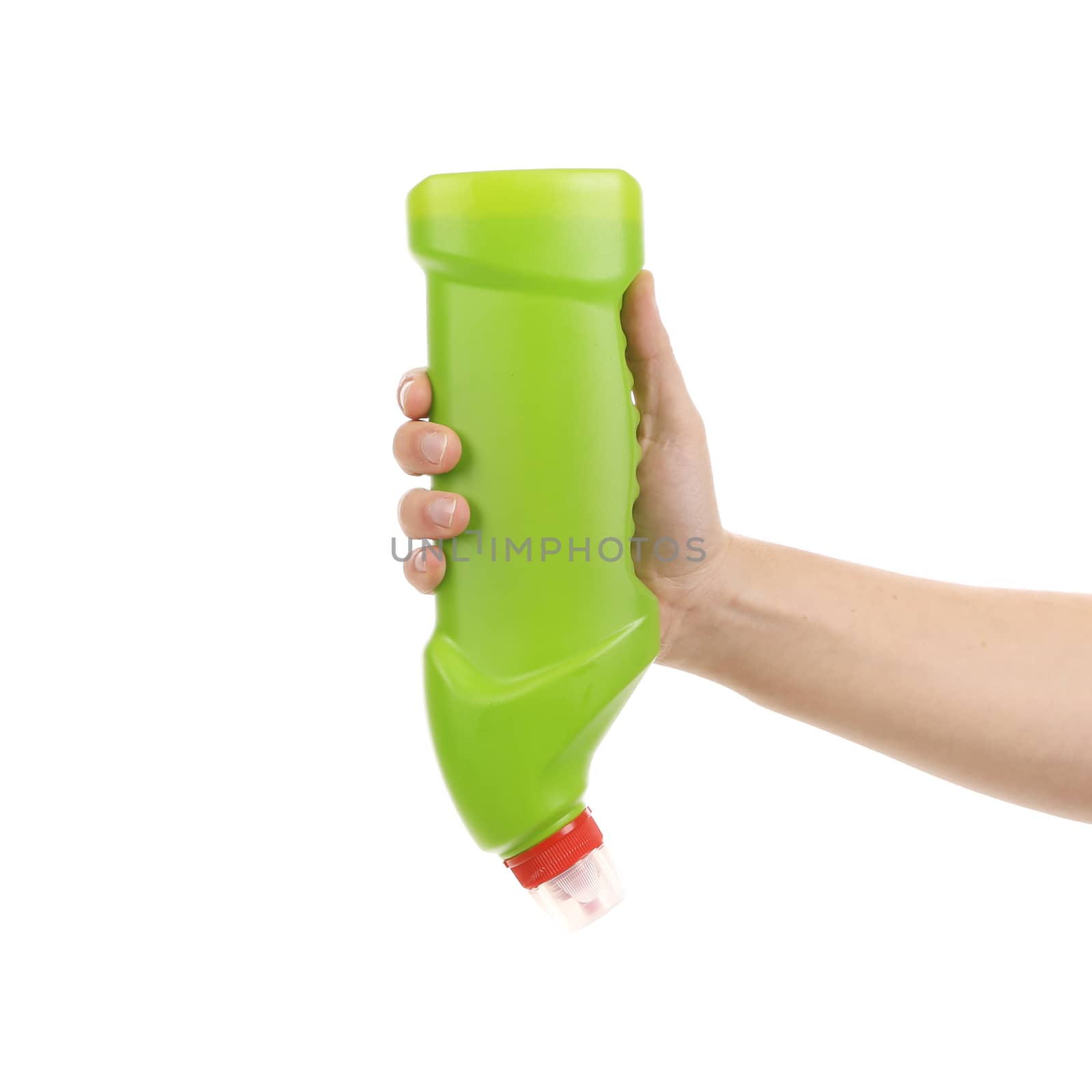 Hand holding green plastic bottle. Isolated on a white background.