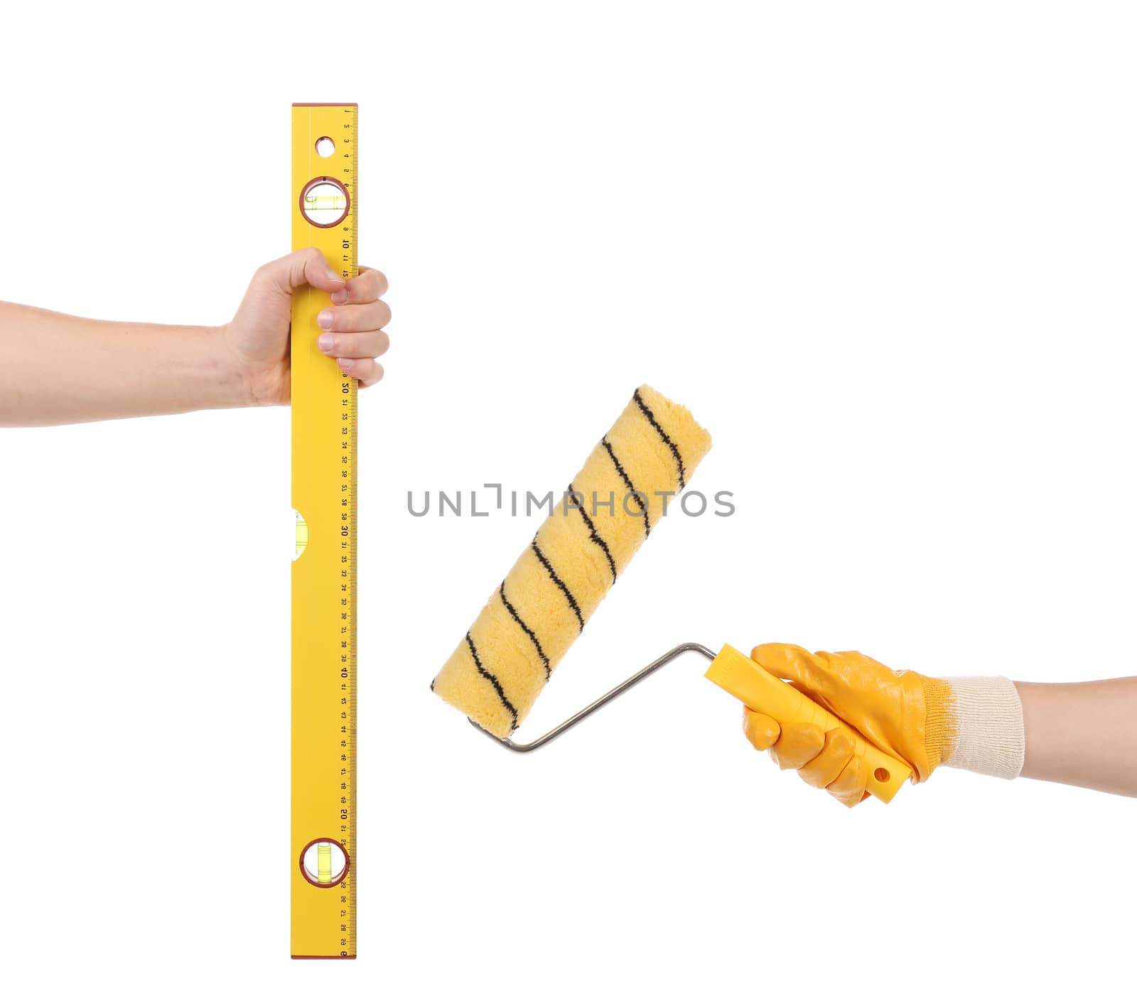 Construction level and roll in hands. Isolated on a white background.