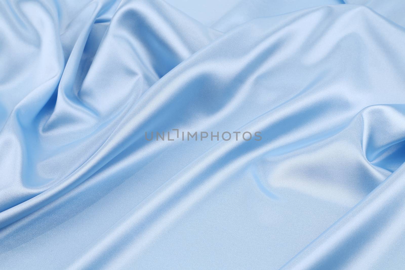 Blue silk background. Close up. Whole background.