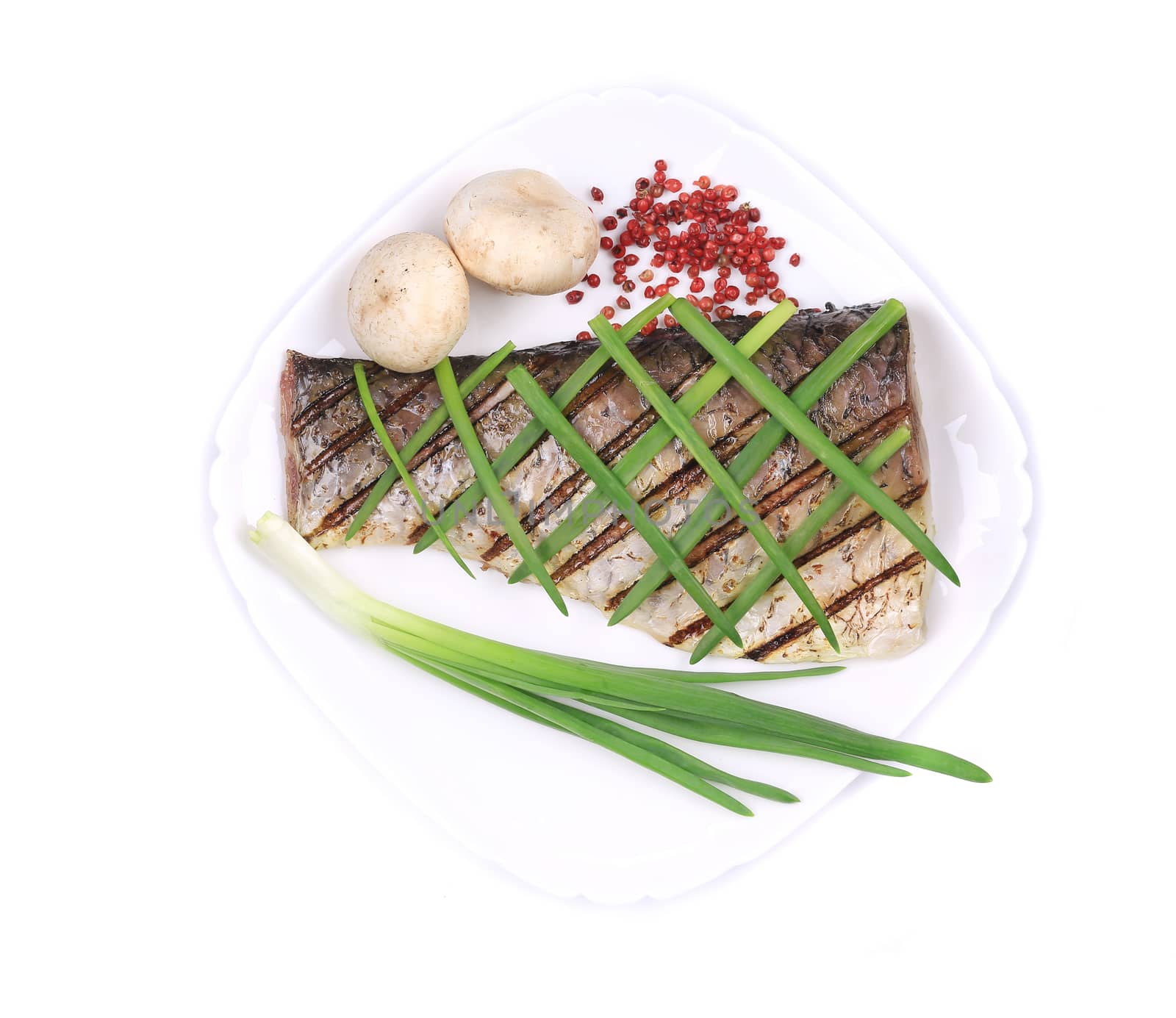 Grilled fish with green onions and peppercorn. Isolated on a white background.