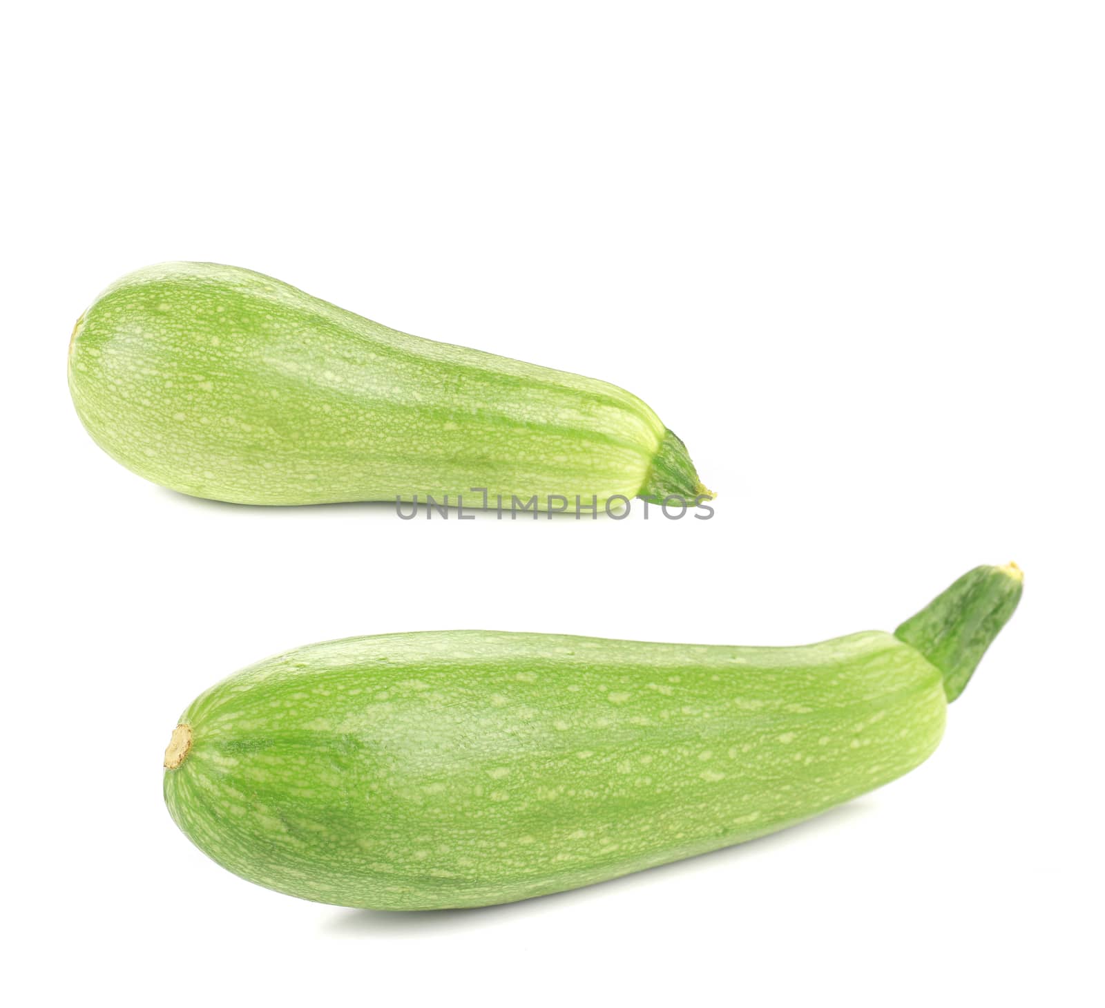 Two ripe zucchini. Isolated on a white background.