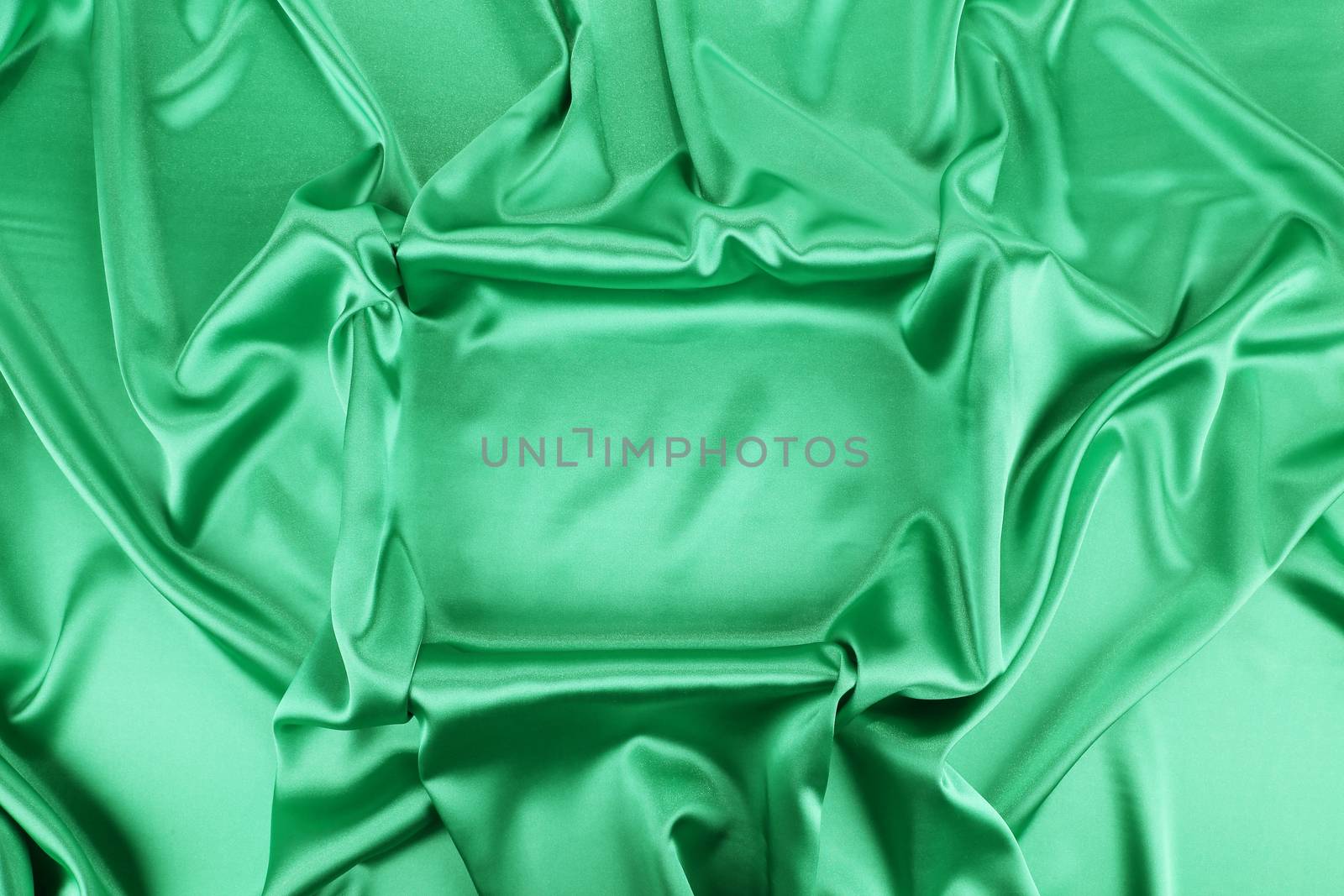 Green silk drapery. Close up. Whole background.