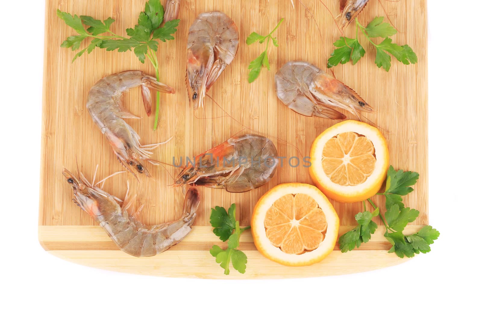 Fresh shrimps with parsley. Isolated on a white background.