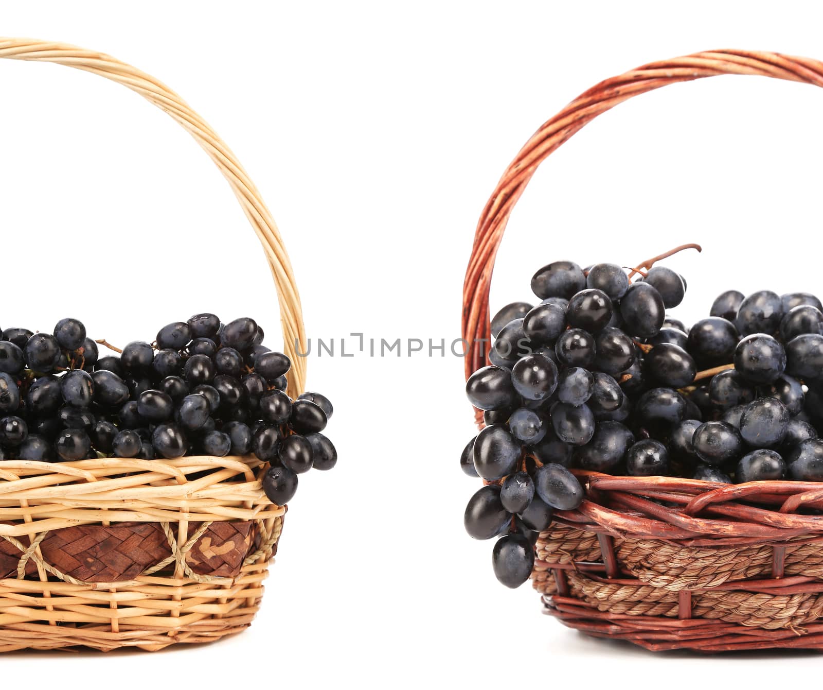 Two basket with red grape. Isolated on a white background.
