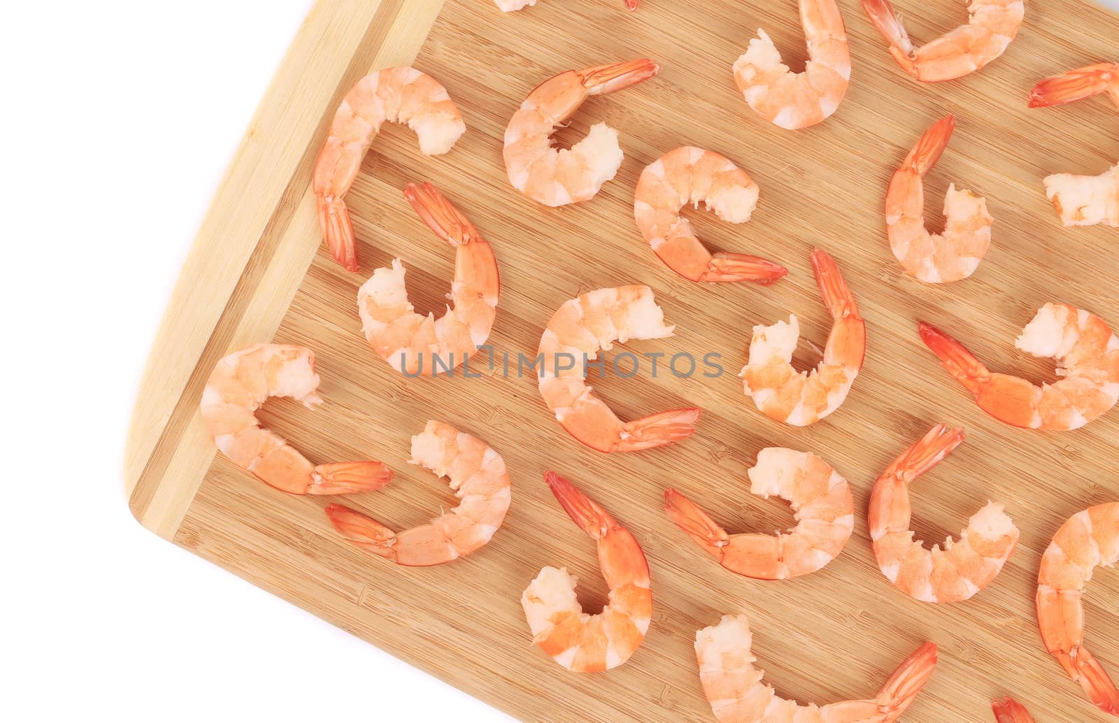 Boiled shrimps on cutting board.