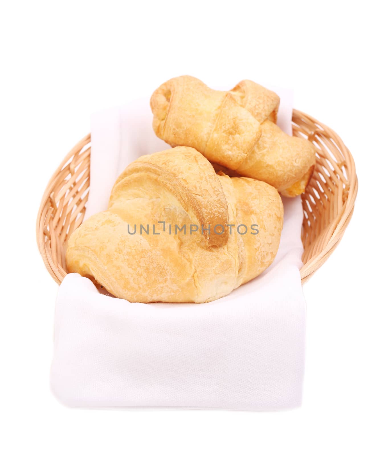 Tasty croissants in basket. Isolated on a white background.