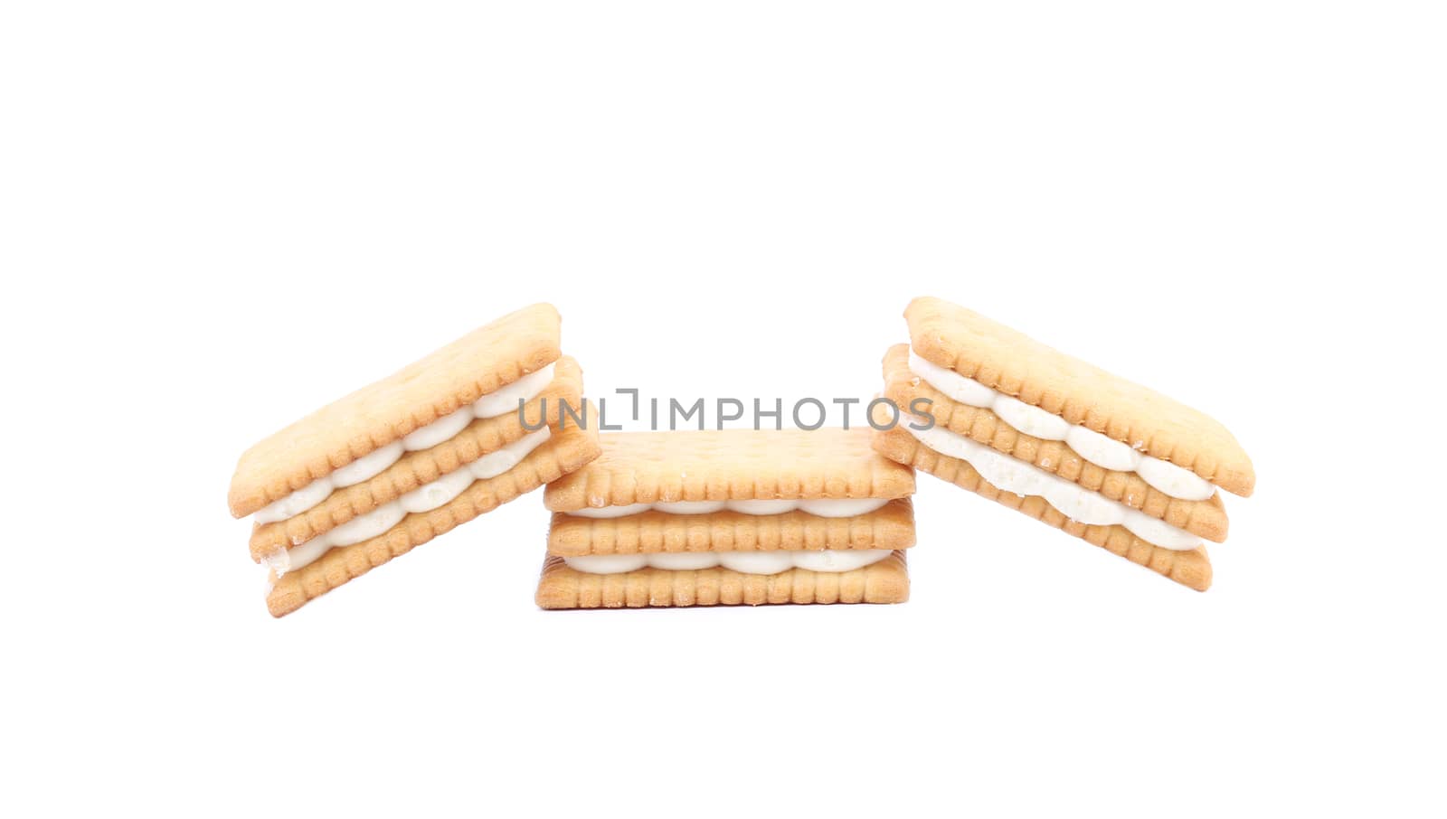 Tasty cream filled cookies. Isolated on a white background.