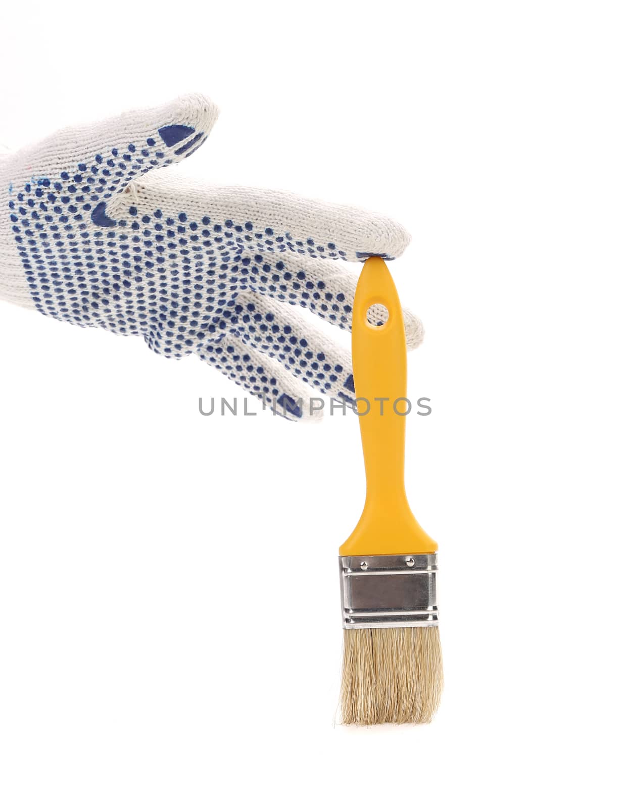 Hand in gloves holds brush. Isolated on a white background.