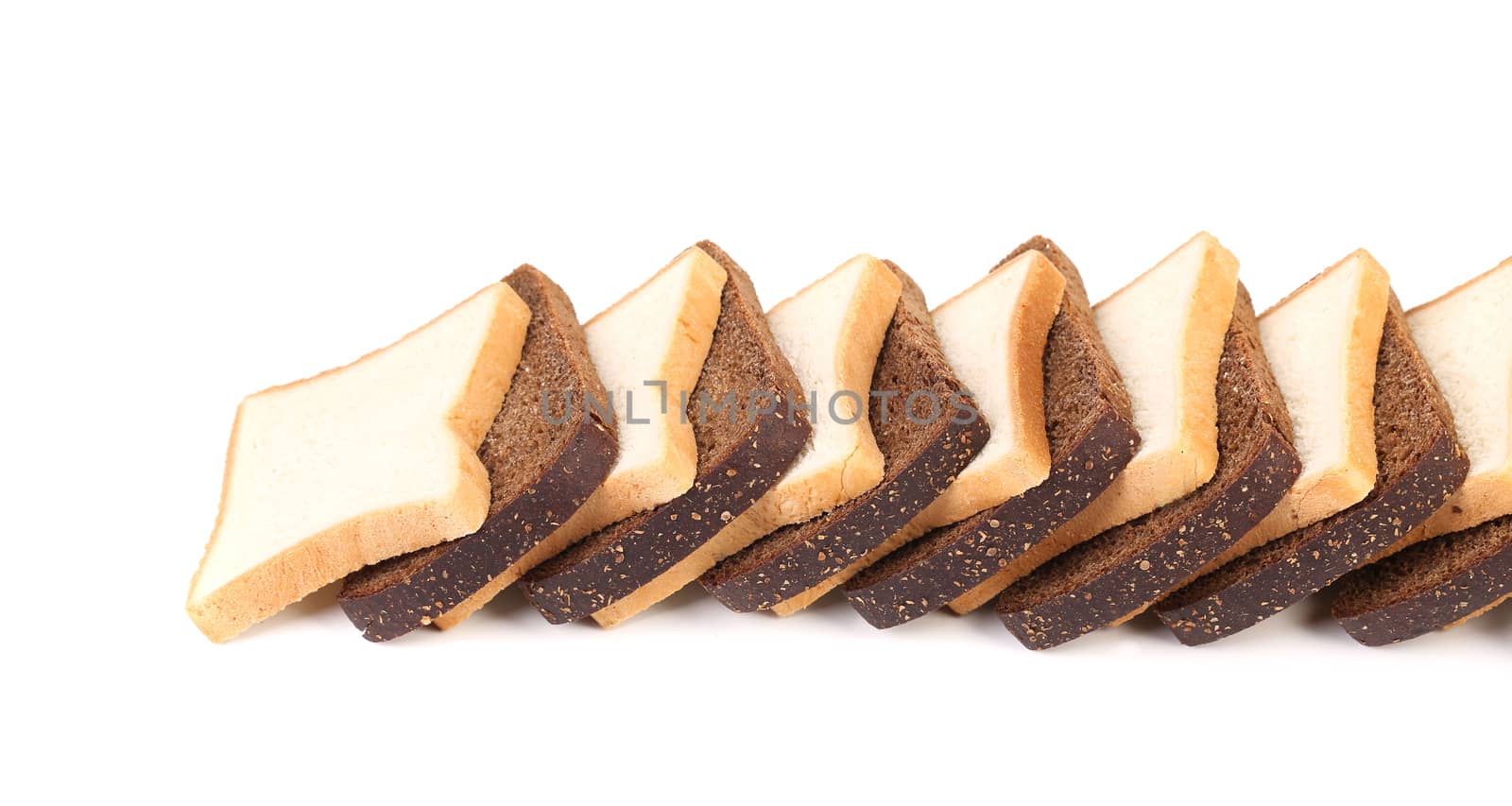 Row of sliced white and black bread. Isolated on a white background.