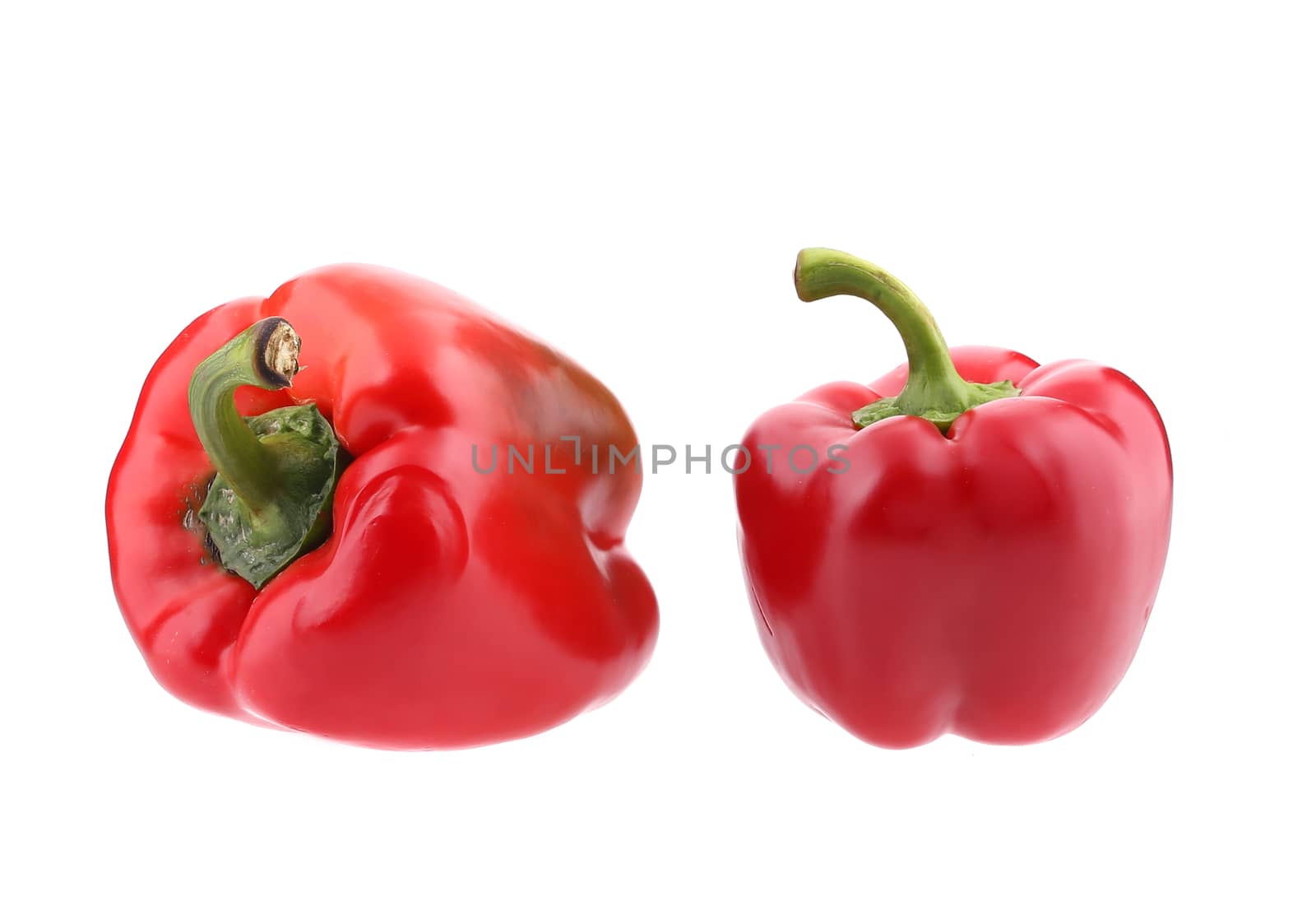 Two red bell peppers. Isolated on a white background.