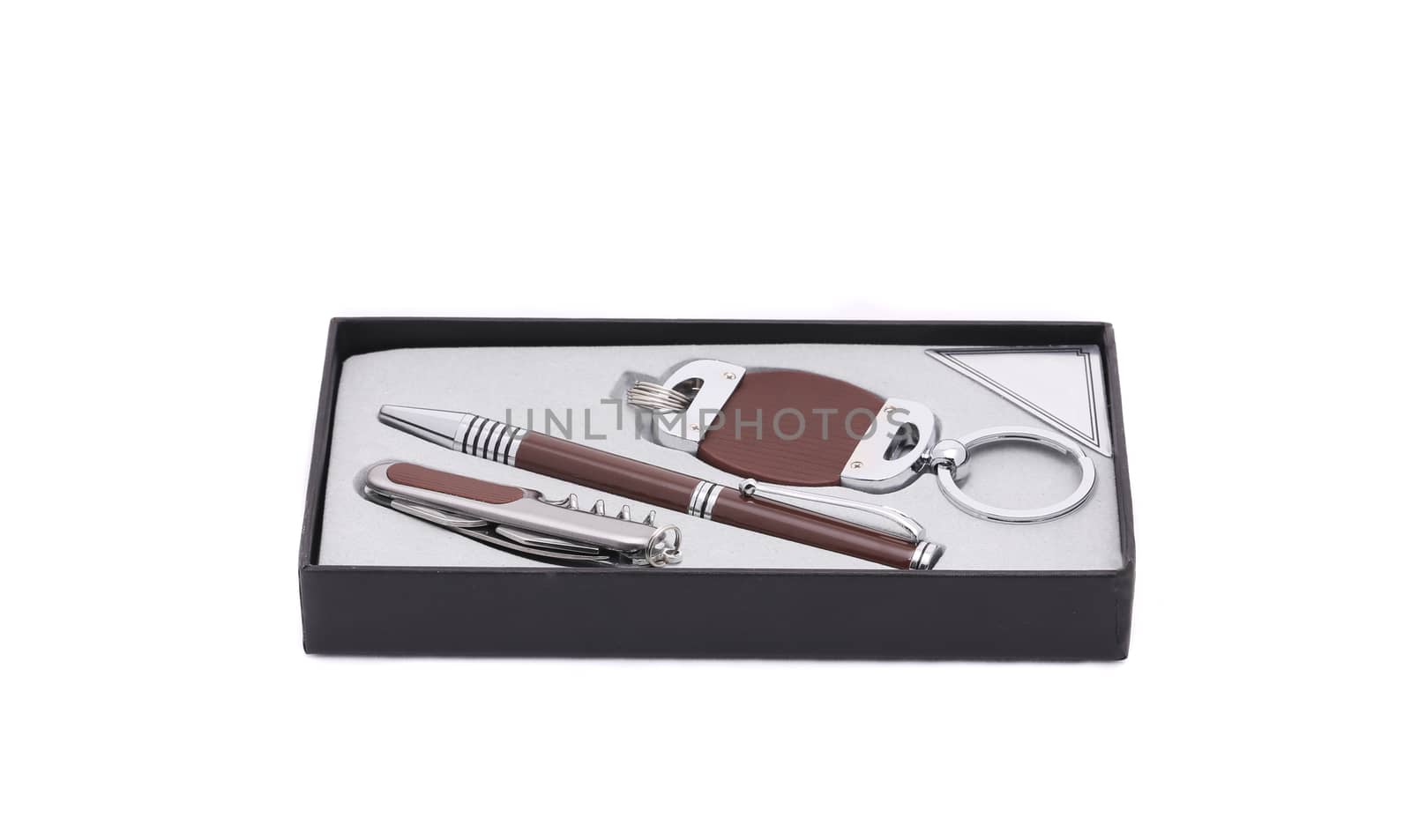 Pen and trinket in a box. Isolated on a white background.