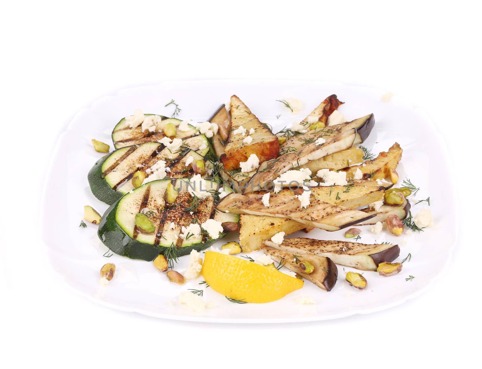 Salad with grilled vegetables and tofu. Isolated on a white background.