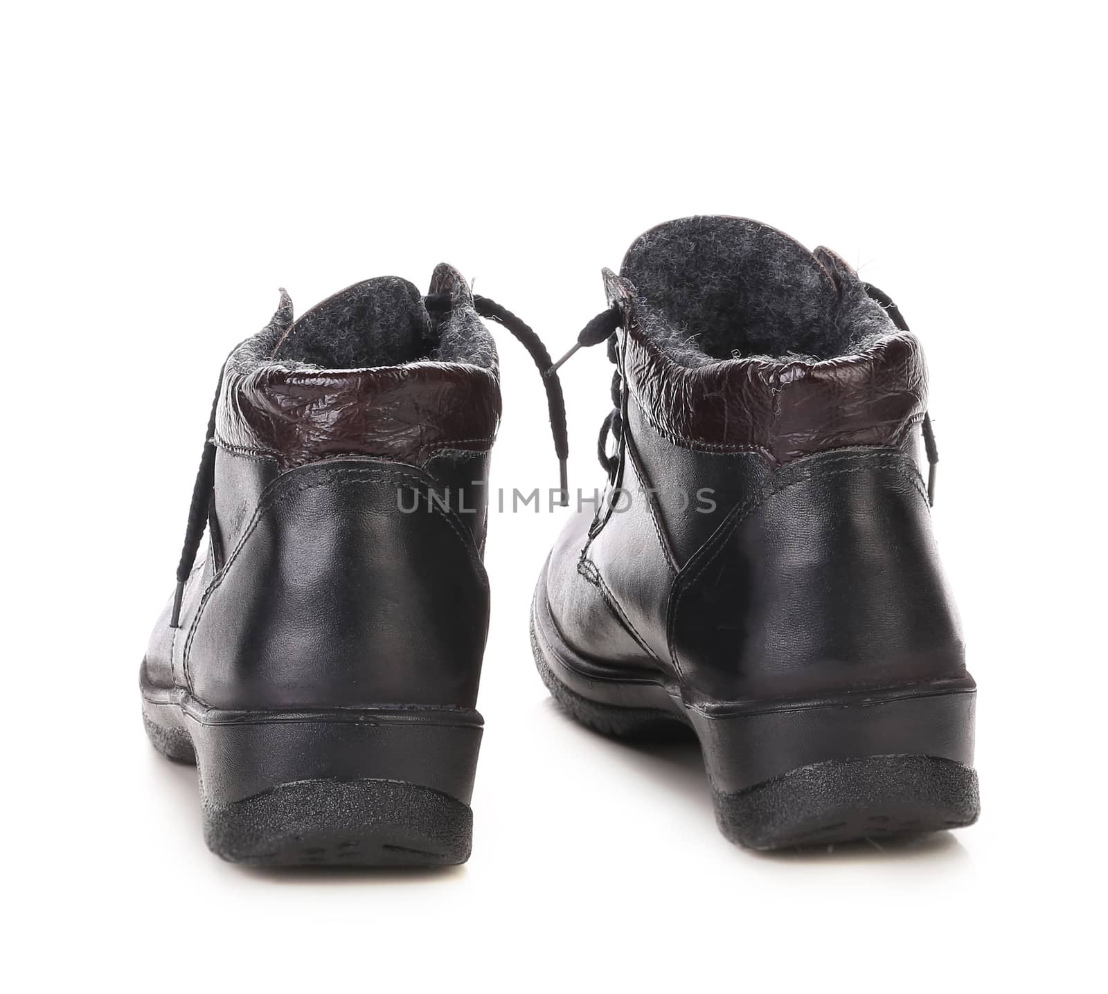 Black winter boots. Isolated on white background.