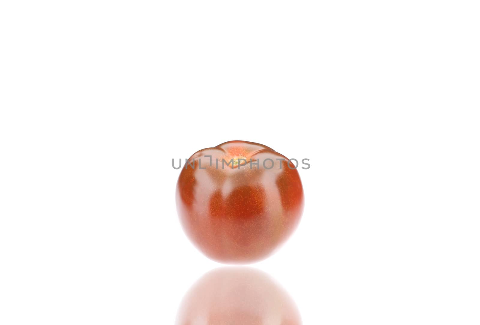 Close up of fresh tomato. Isolated on a white background.