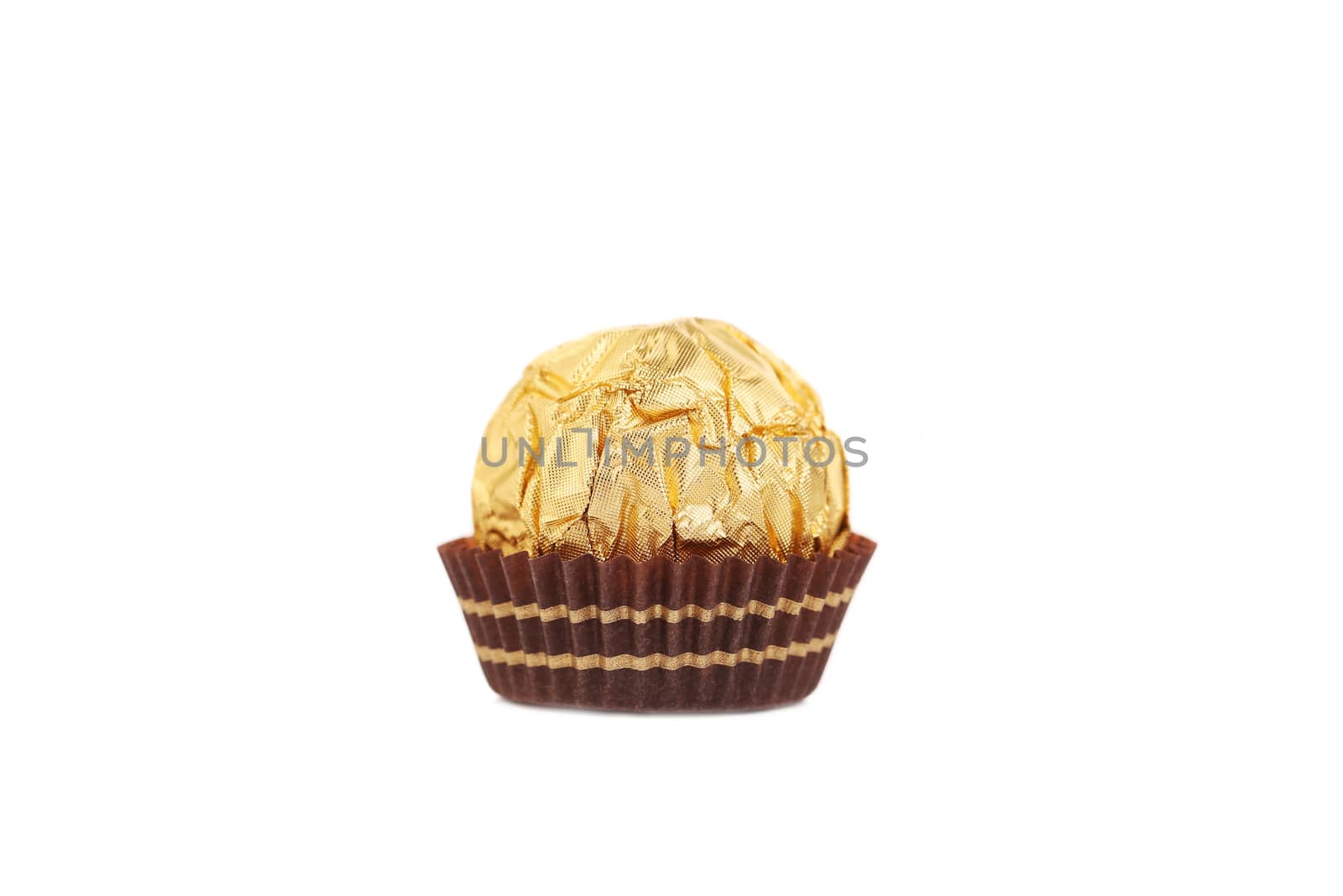 Close up of chocolate gold bonbon. Isolated on a white background.