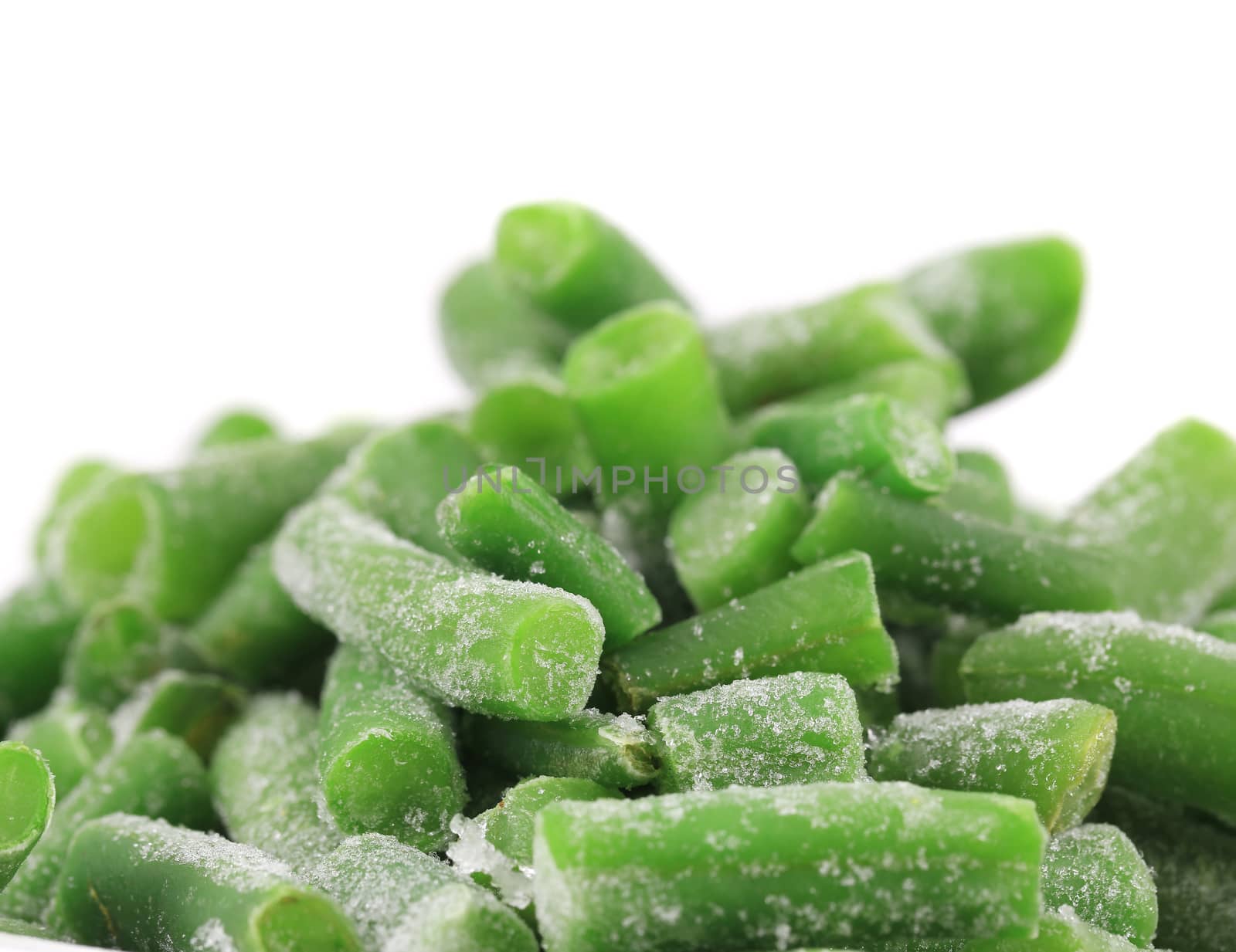 Close up of frozen green beans. Whole background.
