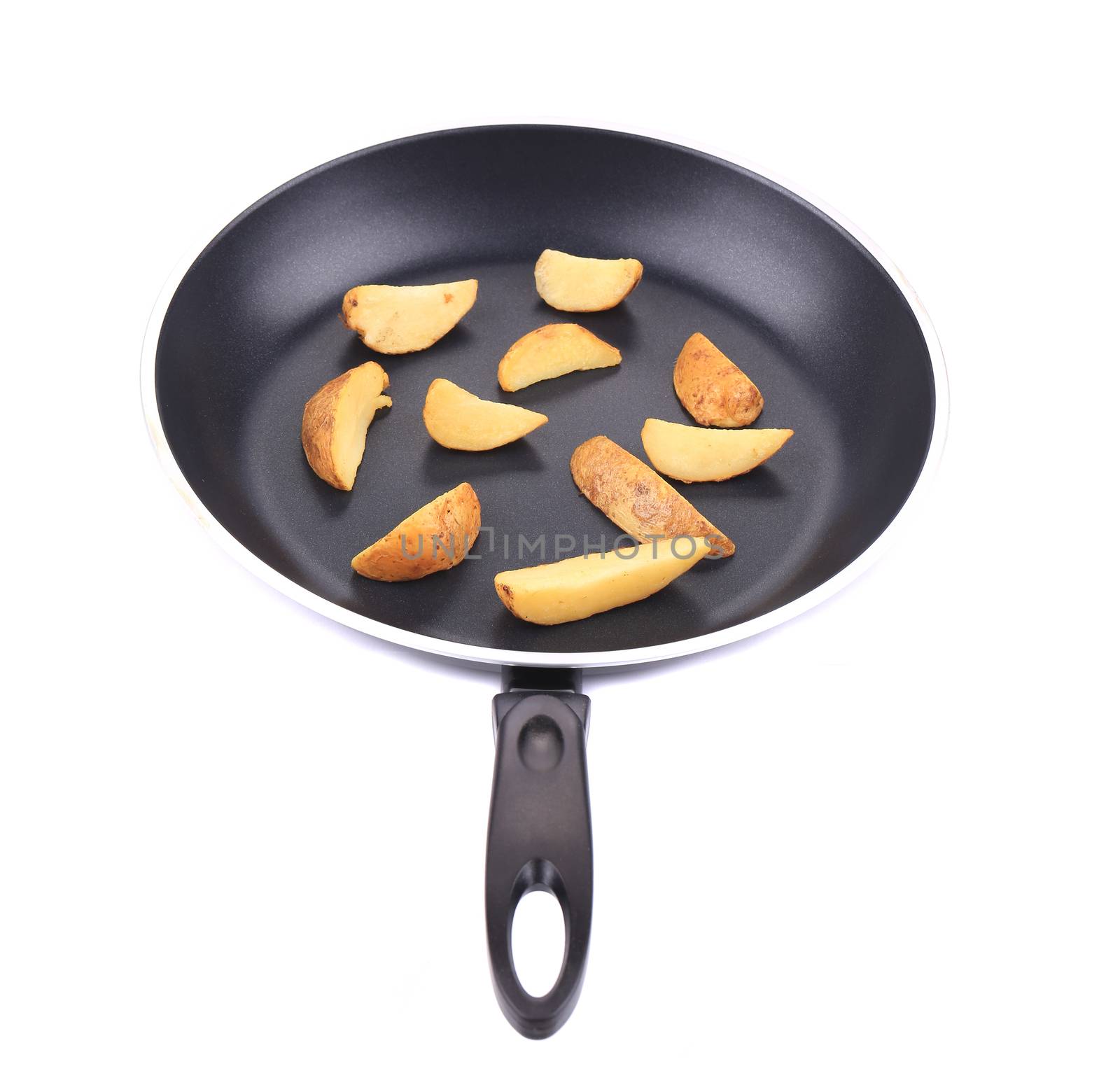 Fried potatoes on a black frying pan. On a white background.