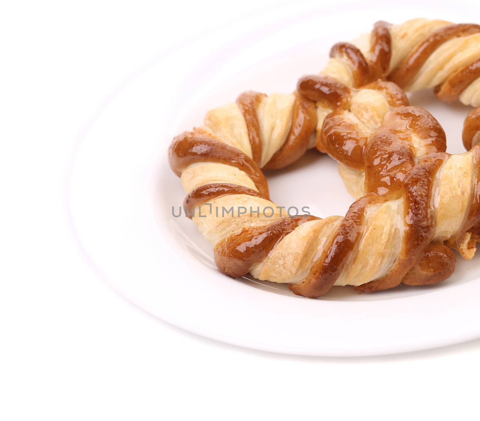 Beautiful knot-shaped biscuit. Isolated on a white background.