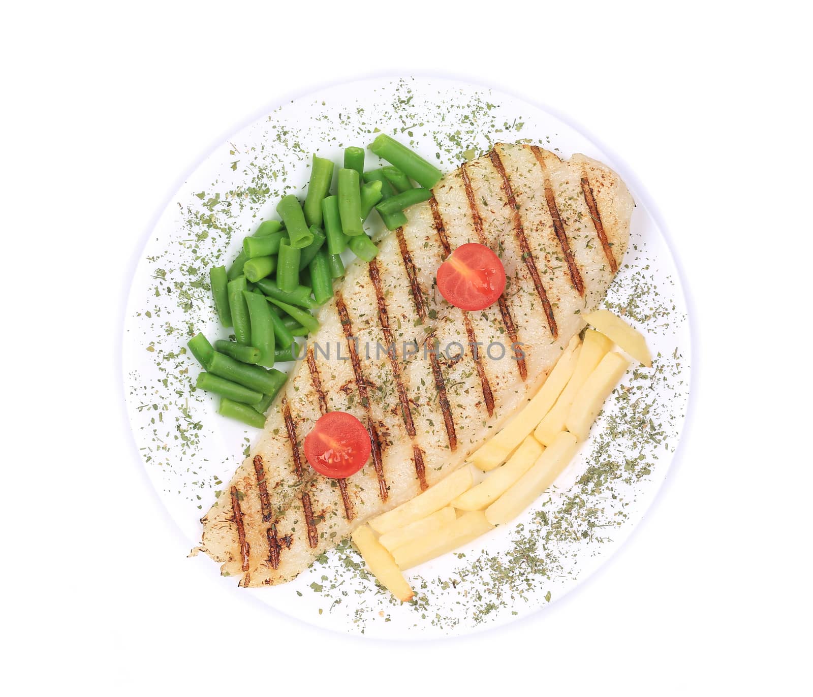 Pangasius fillet grilled with vegetables. Isolated on a white background.