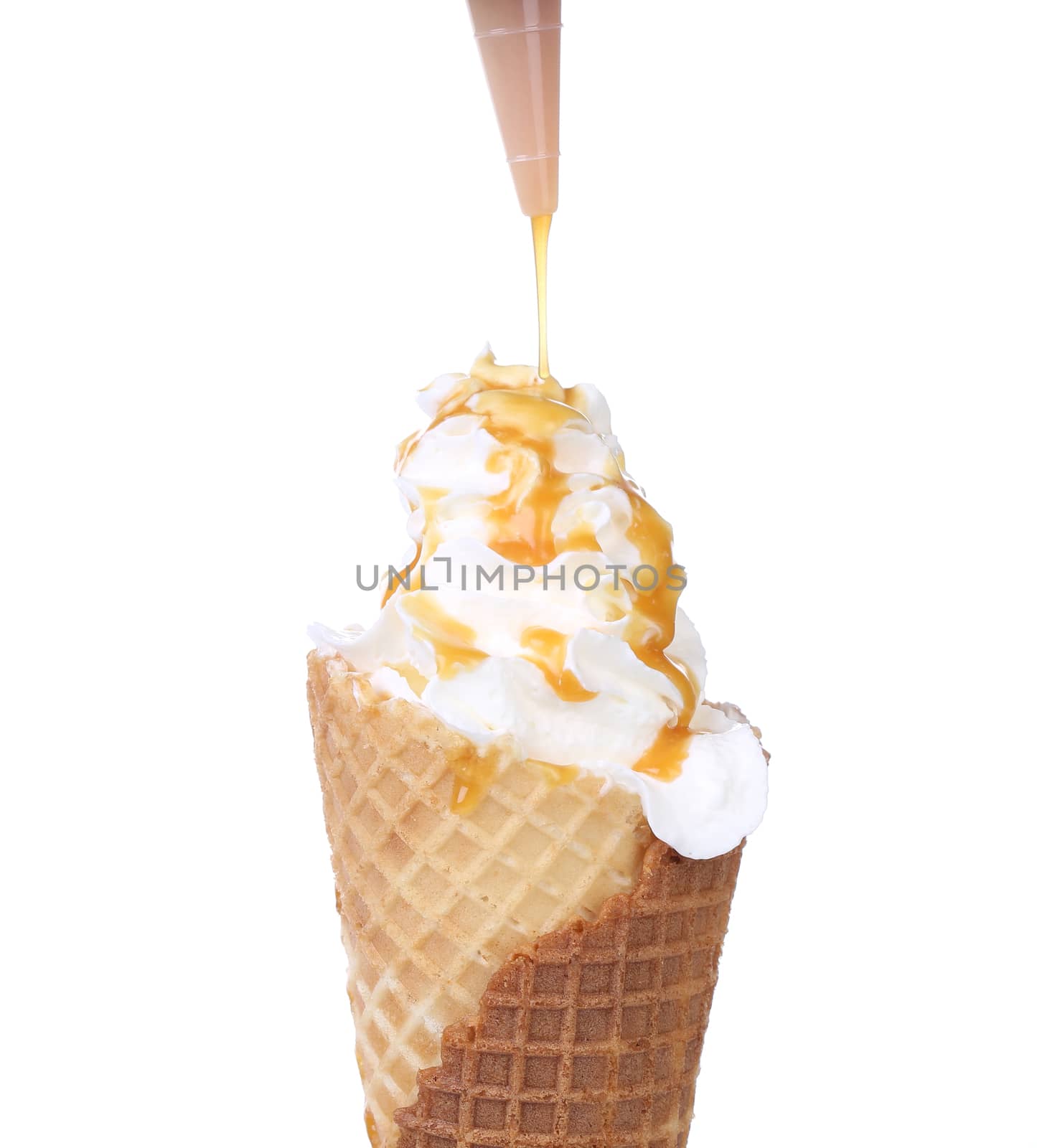 White ice creame in cone. Isolated on a white background.
