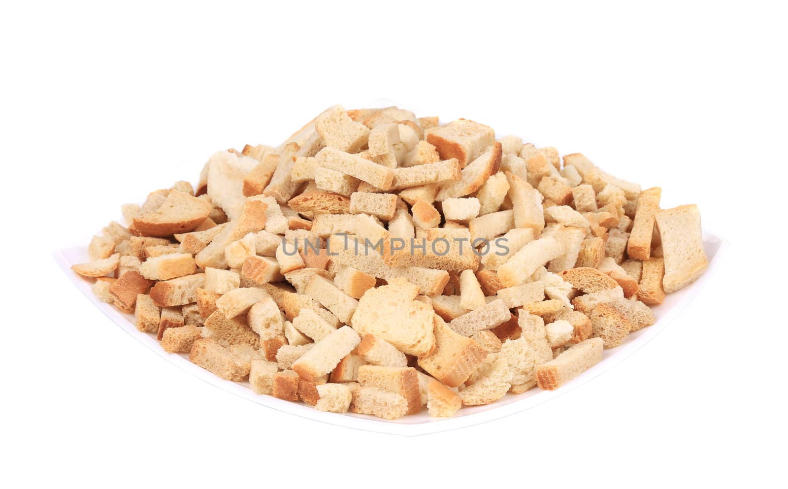 Croutons in a porcelain plate. Isolated on a white background.