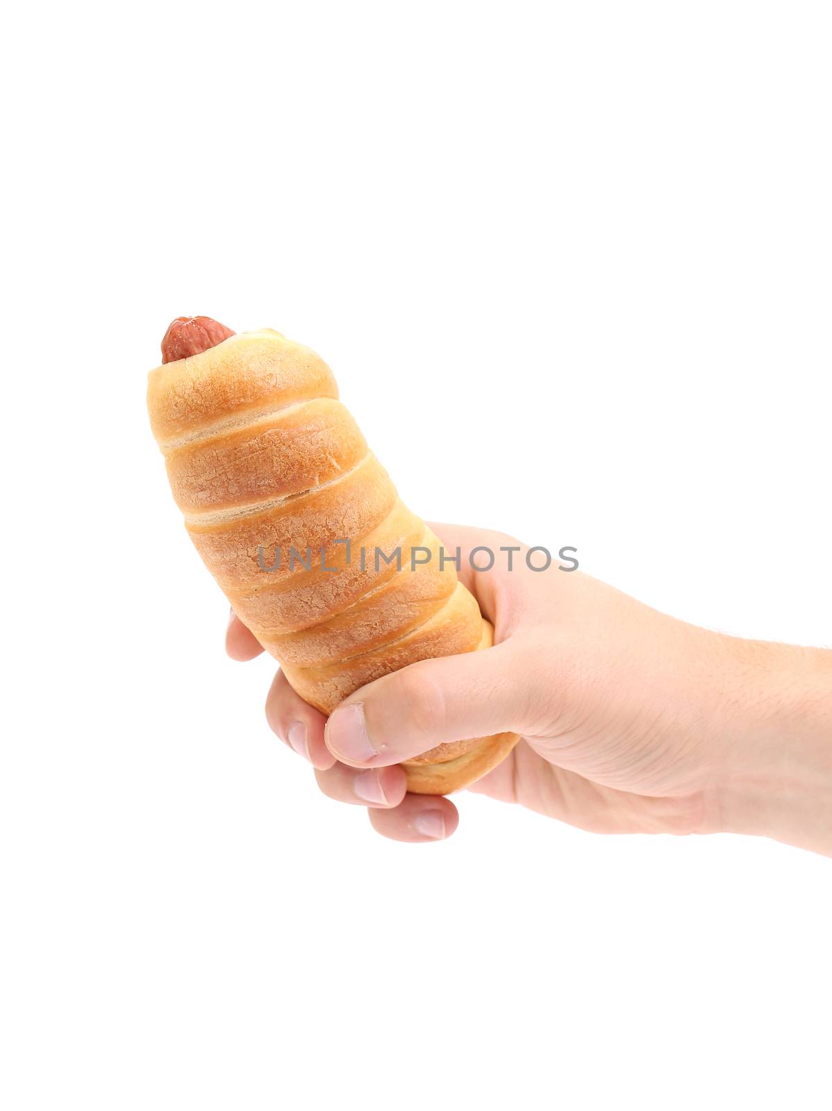 Hand holds hot dog baked. Isolated on a white background.