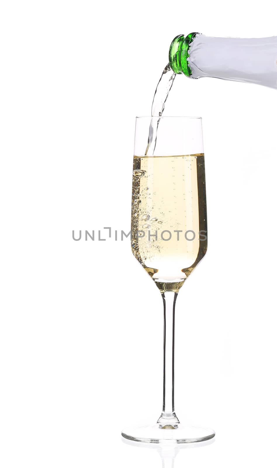 Champagne pouring in a glass. Isolated on a white background.