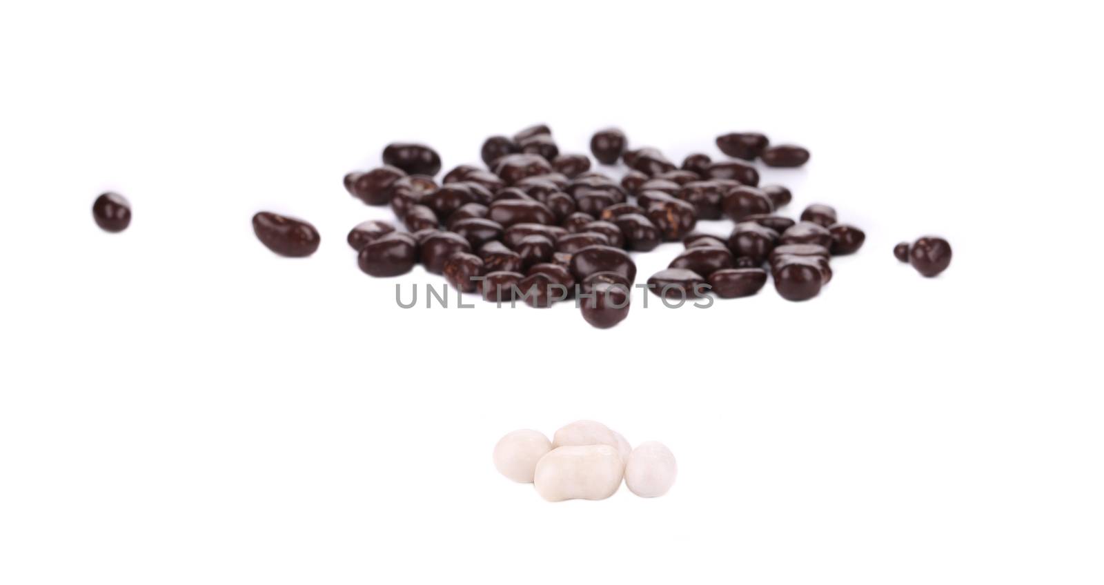 Chocolate dragee brown and white. Blurred background.