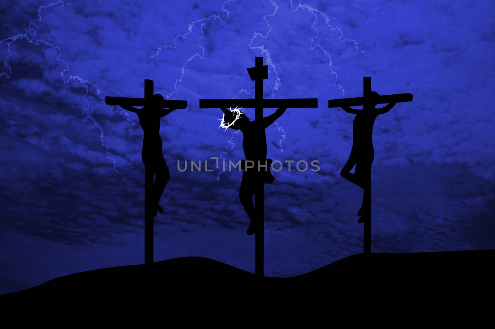 Silhouettes of the three crosses on a hill