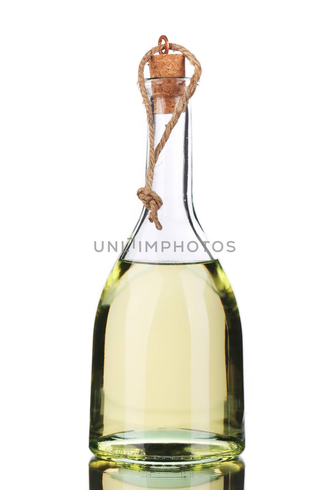 Small bottle of olive oil with cork stopper. Isolated on a white background.