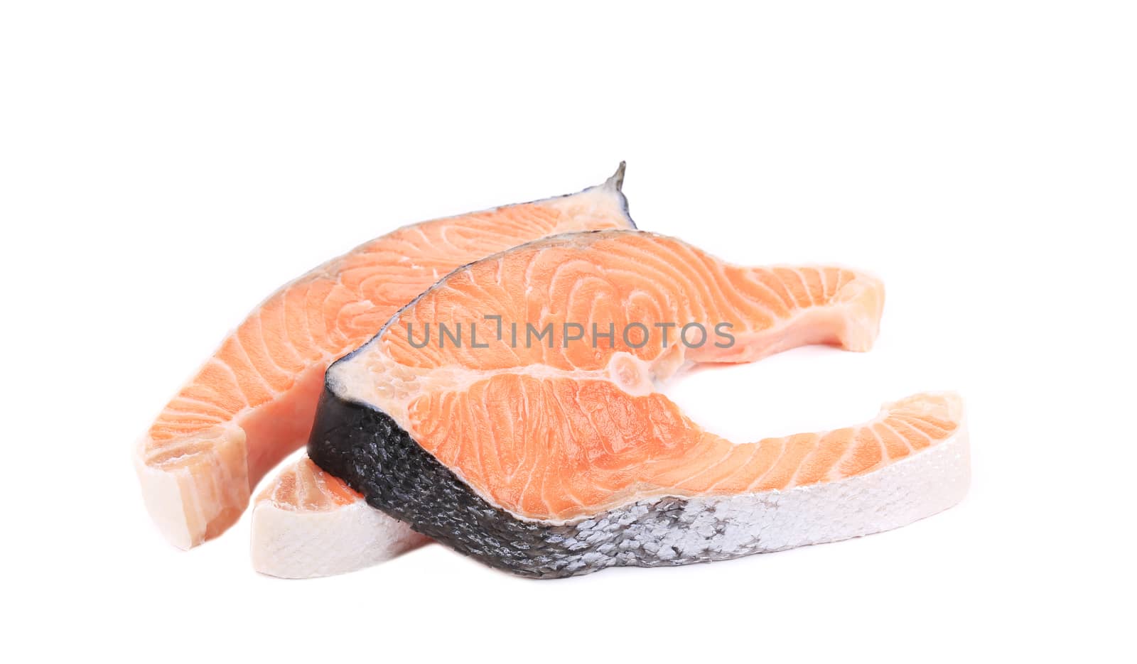 Two fresh salmon steaks. Isolated on a white background.