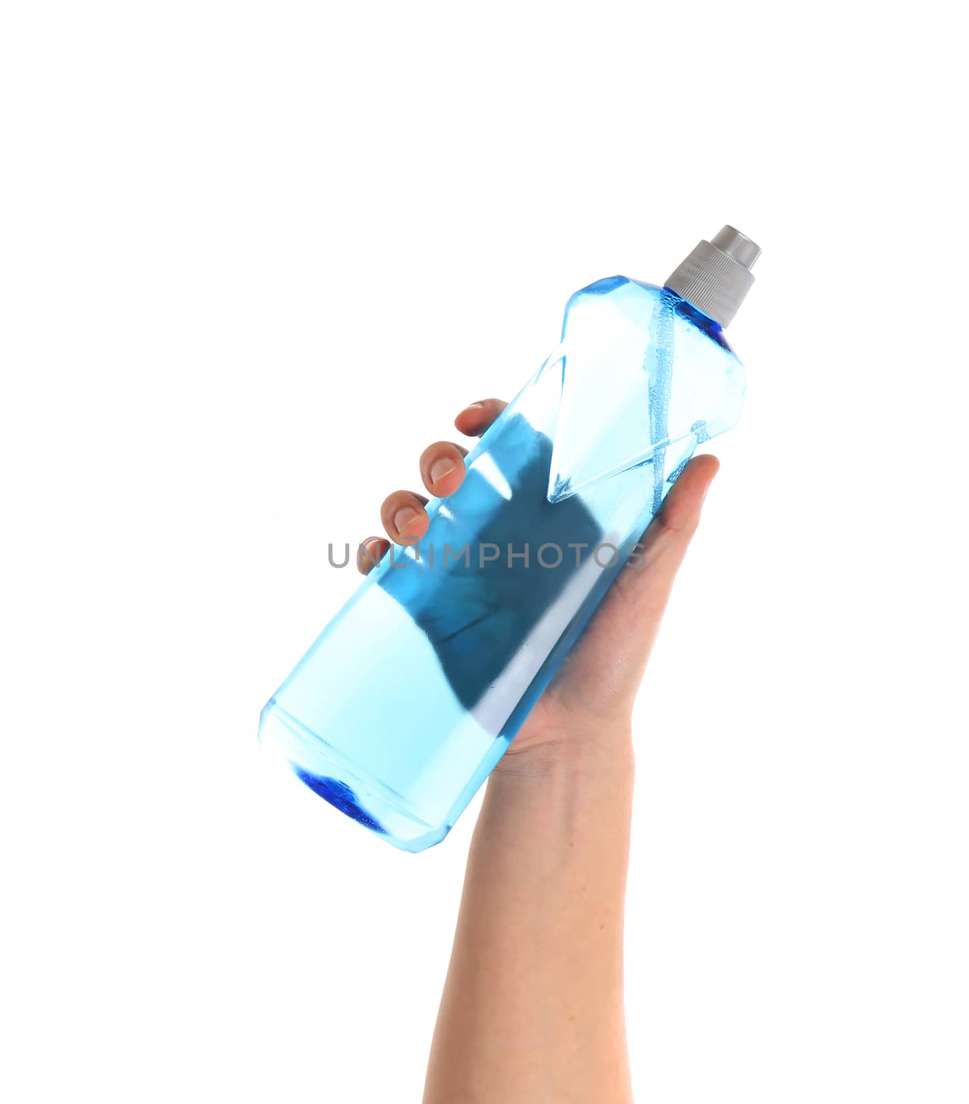 Blue bottle in a hand. Isolated on a white background.