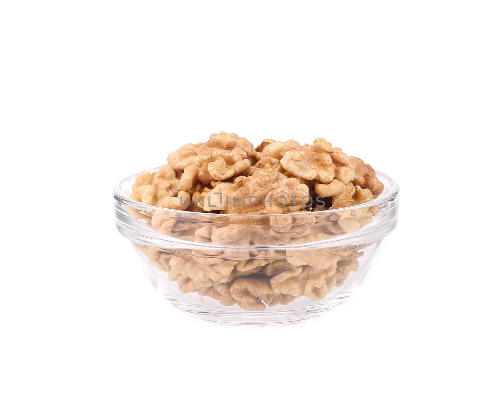 Glass bowl with walnuts. by indigolotos