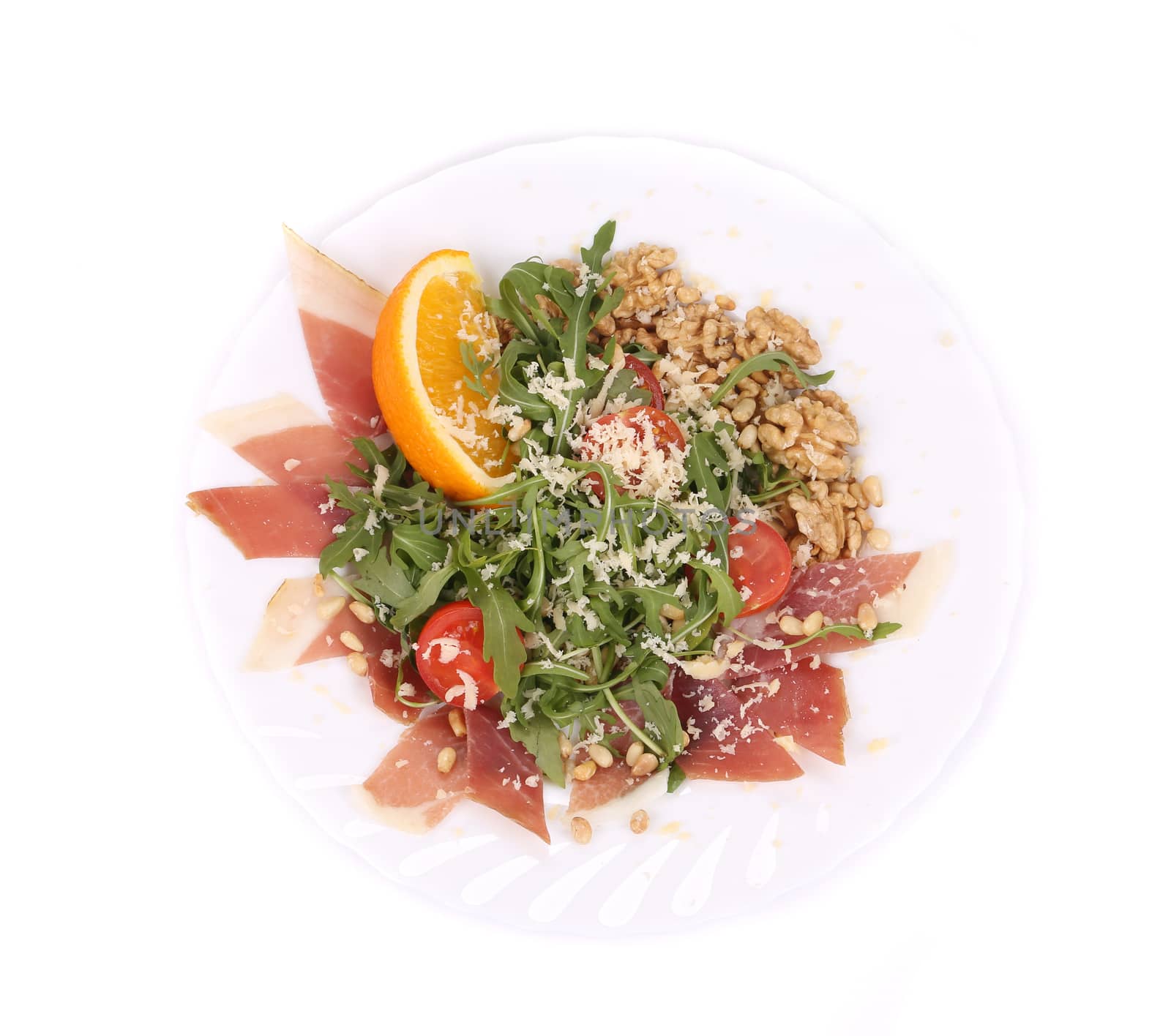 Salad with arugula and prosciutto. Isolated on a white background.