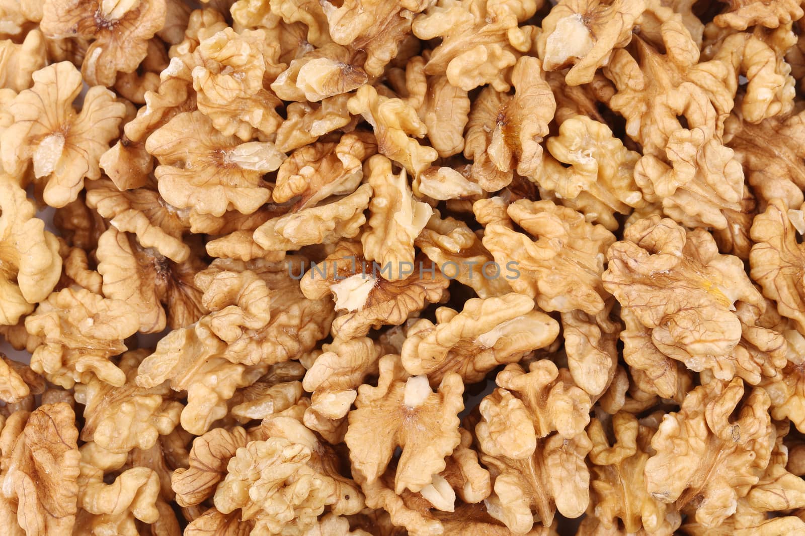 Texture of walnuts close up. Whole background.