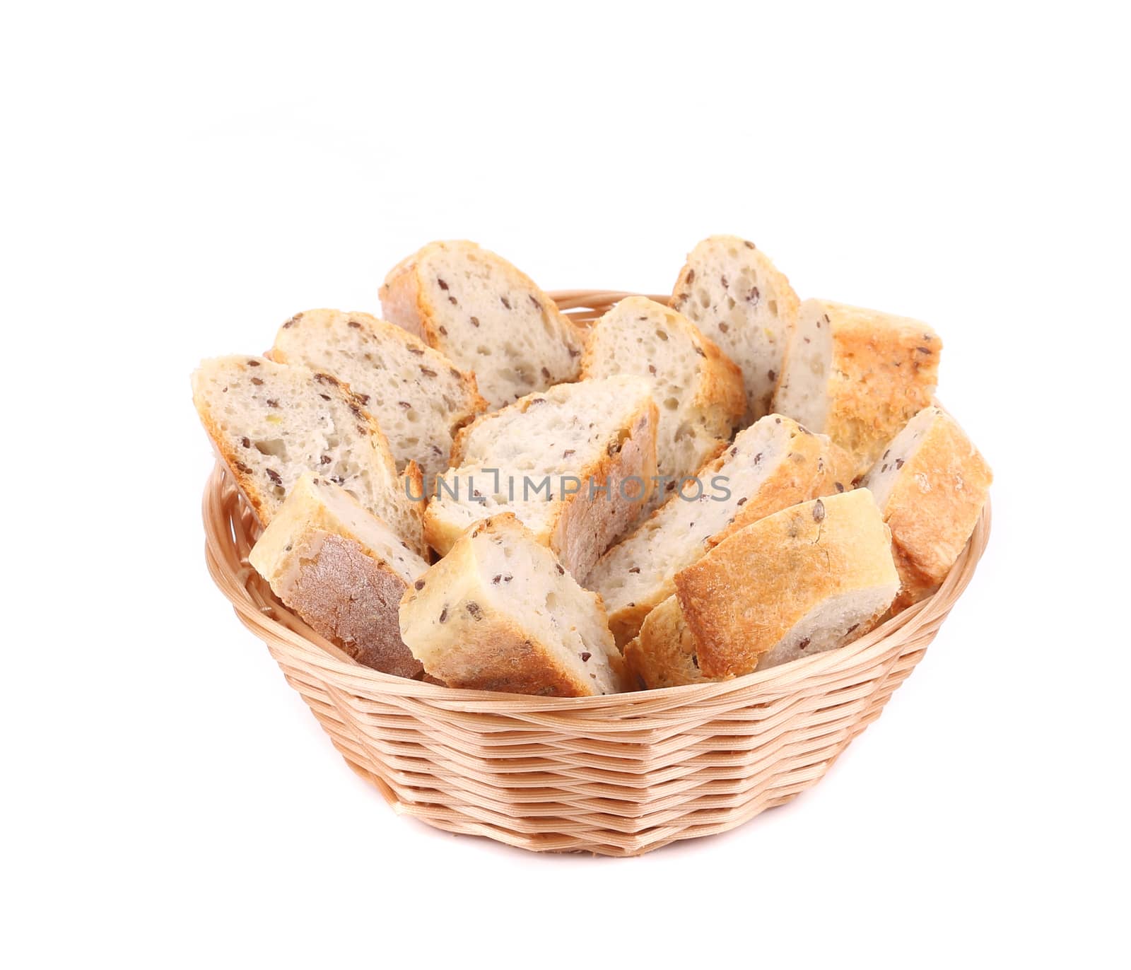 Wicker basket with bread slices. Isolated on a white background.