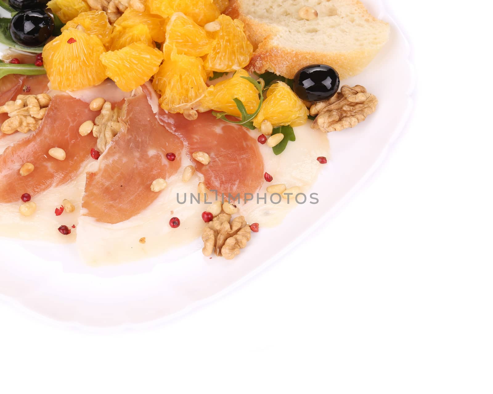 Salad with arugula and prosciutto. Whole background.