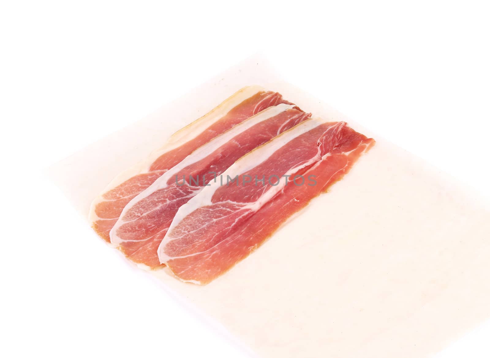 Slices of Delicious Prosciutto. Isolated on a white background.