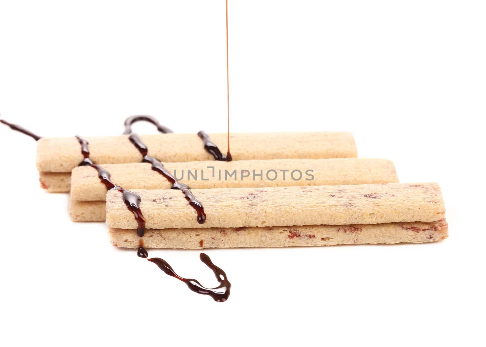 Coated cookie of chocolate. Isolated on a white background.