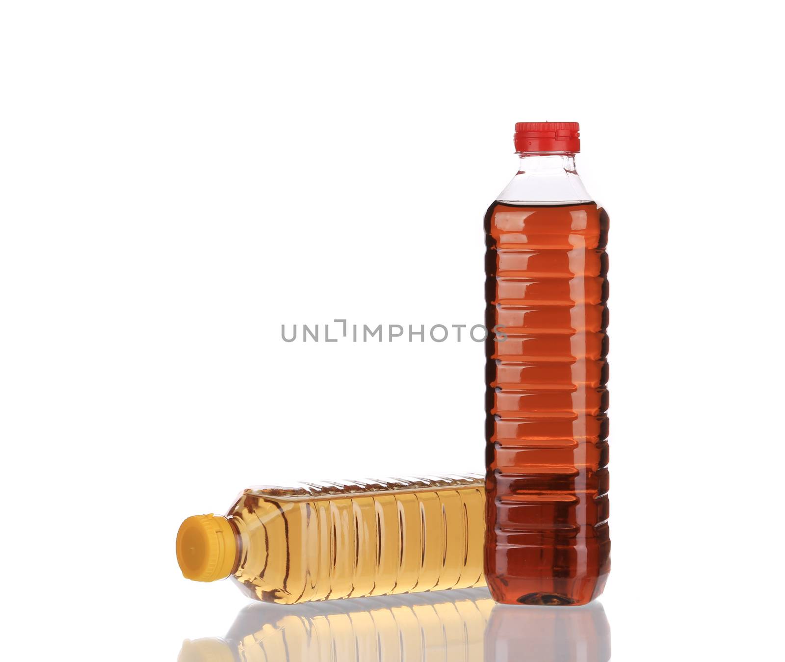 Two bottles of vinegar. Isolated on a white background.