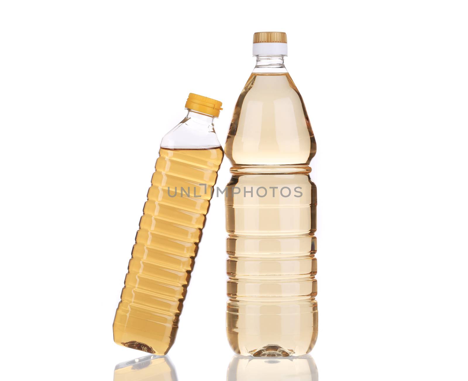 Two bottles of vinegar. Isolated on a white background.