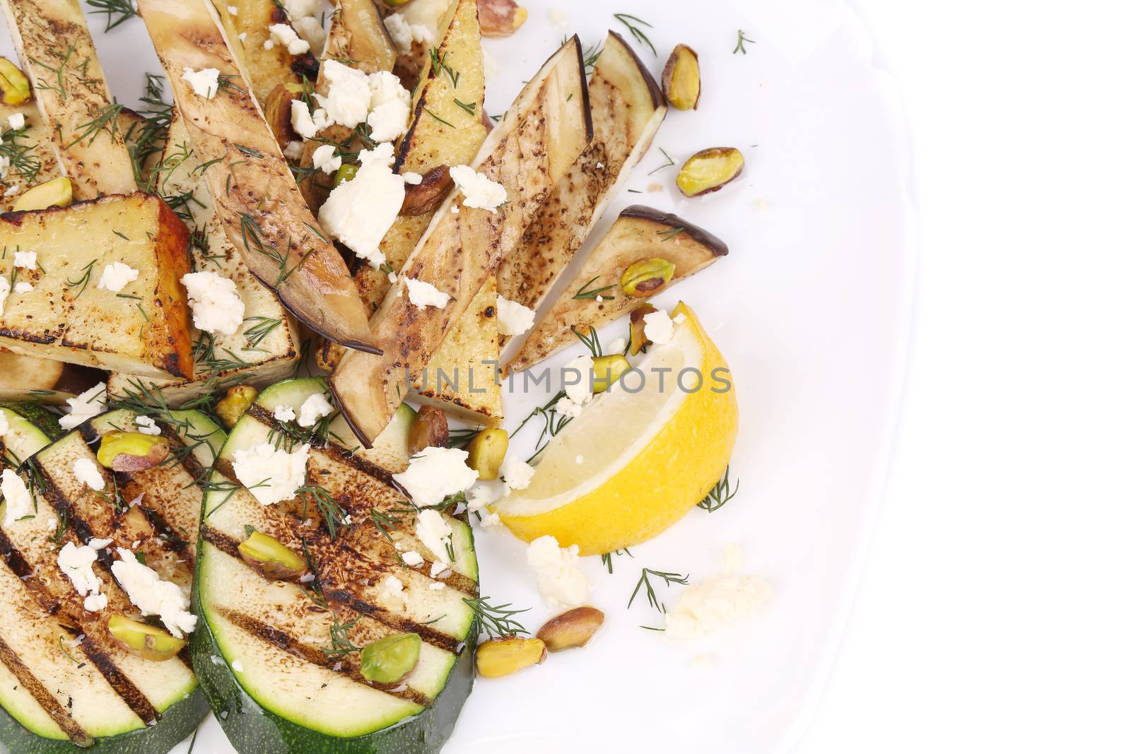 Salad with grilled vegetables and tofu. Isolated on a white background.