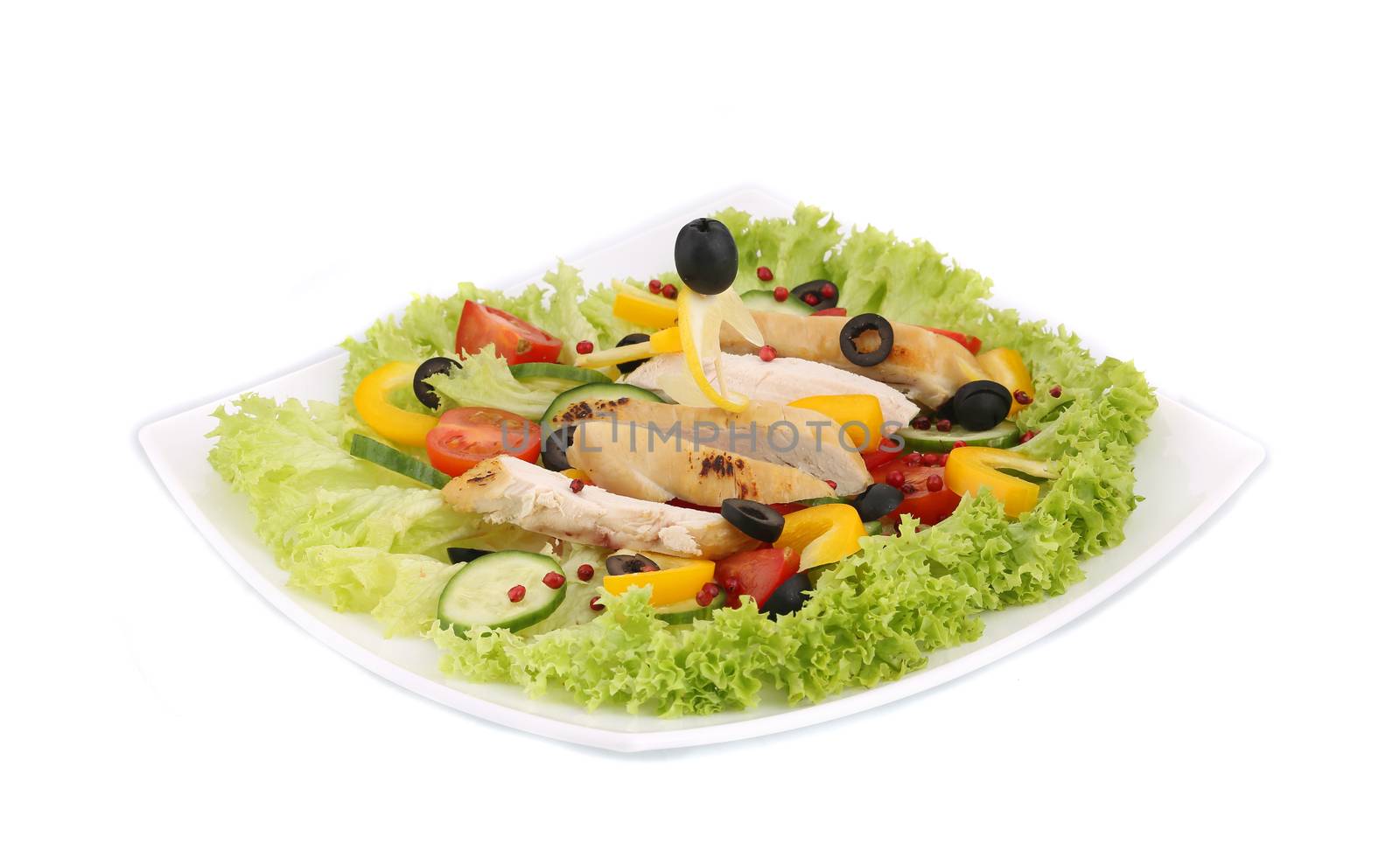 Chicken salad with tomatoes. Isolated on a white background.