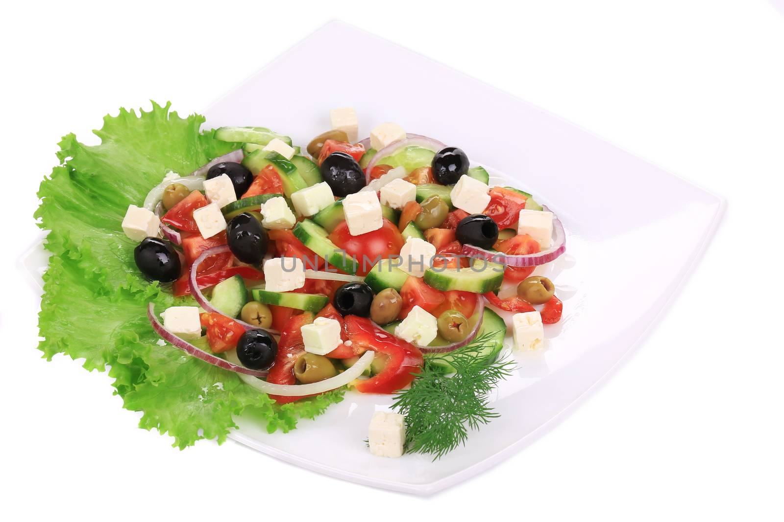 Greek salad. Isolated on a white background.