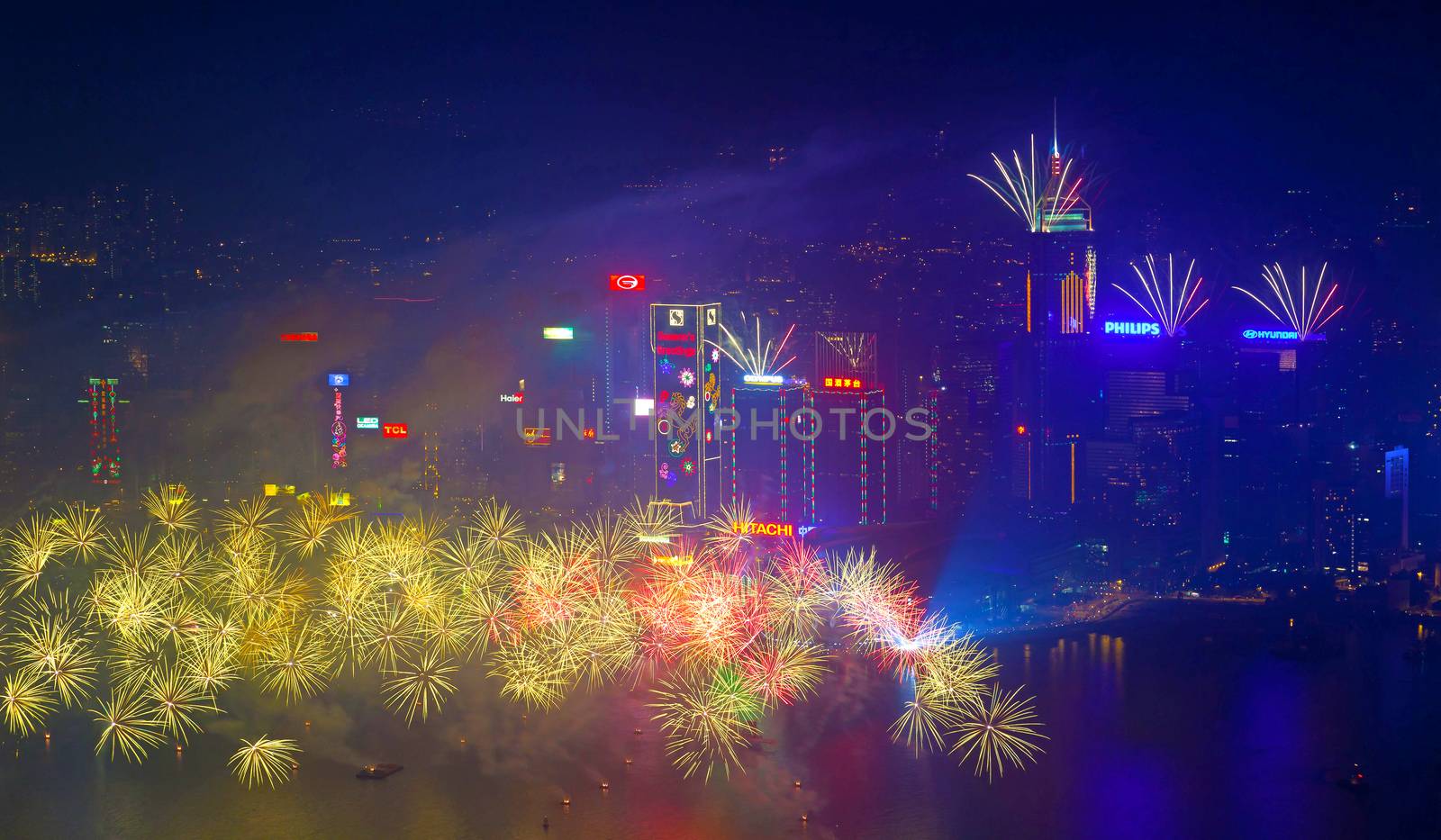 HONG KONG - JANUARY 1: A splendid firework show and countdown celebration held in Hong Kong on January 1, 2014. The show lasted for 8 minutes and lighted up the skies above Hong Kong skyscrapers.