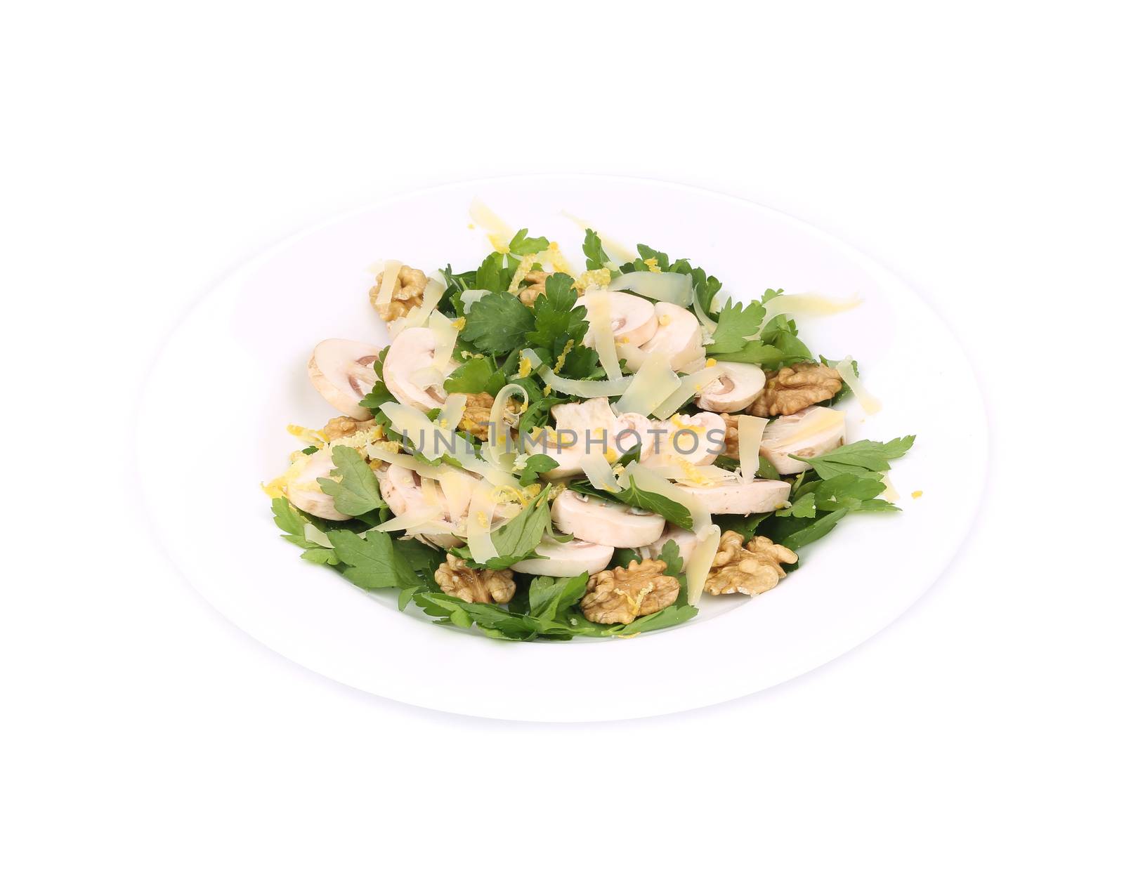 Mushroom salad with walnuts and parsley. Isolated on a white background.
