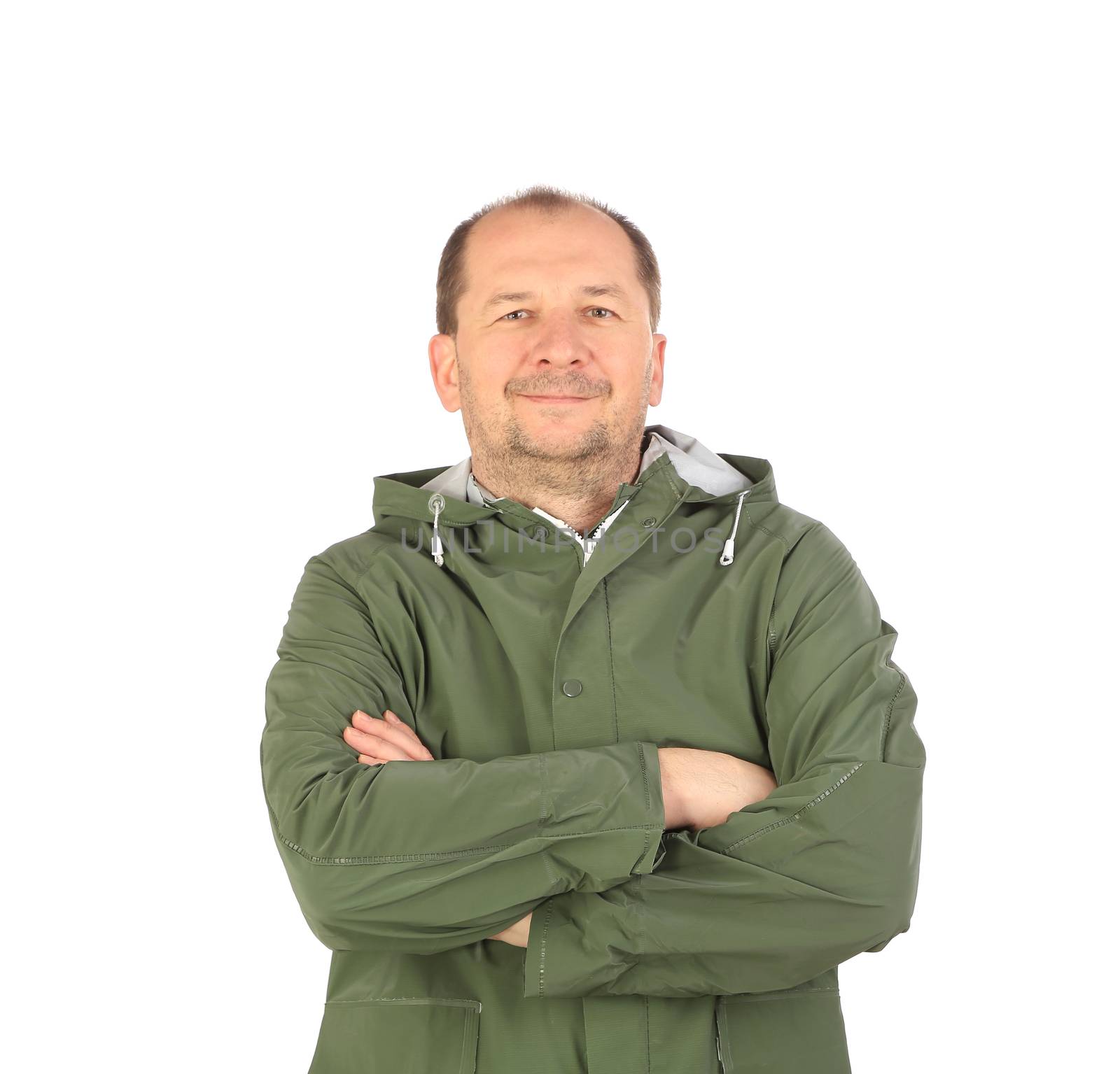 Man in green coat with crossed arms. Isolated on a white background.